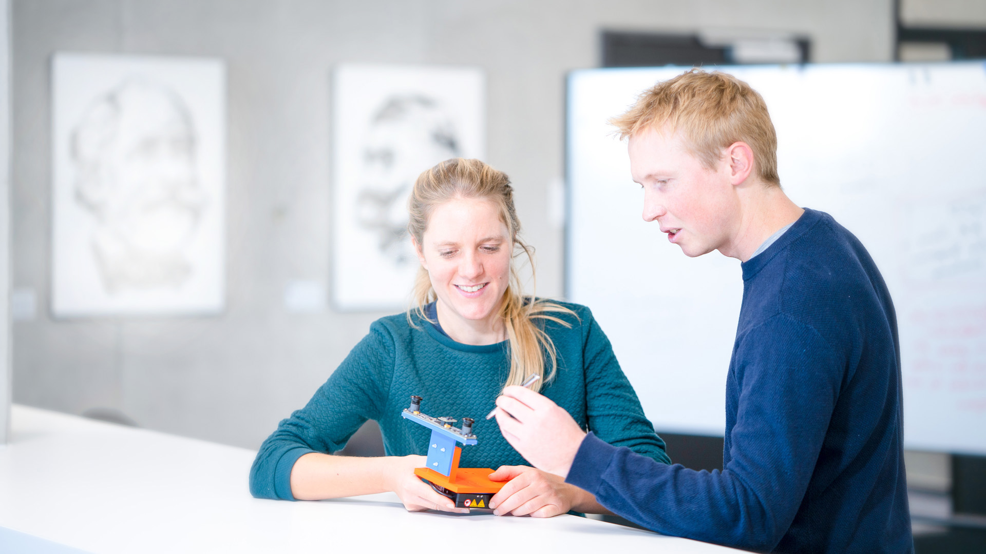 Two Researchers working on a prototype in the lab