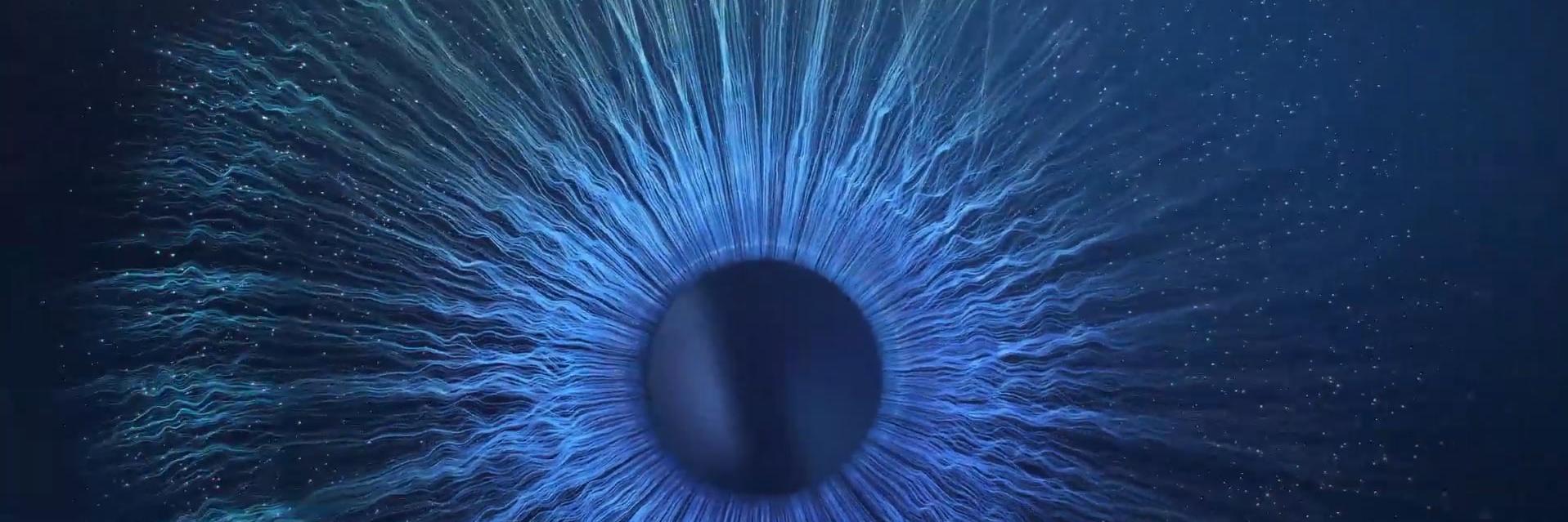 Challenge the Limits of Imagination motion - a close up of a blue eyeball in the dark.