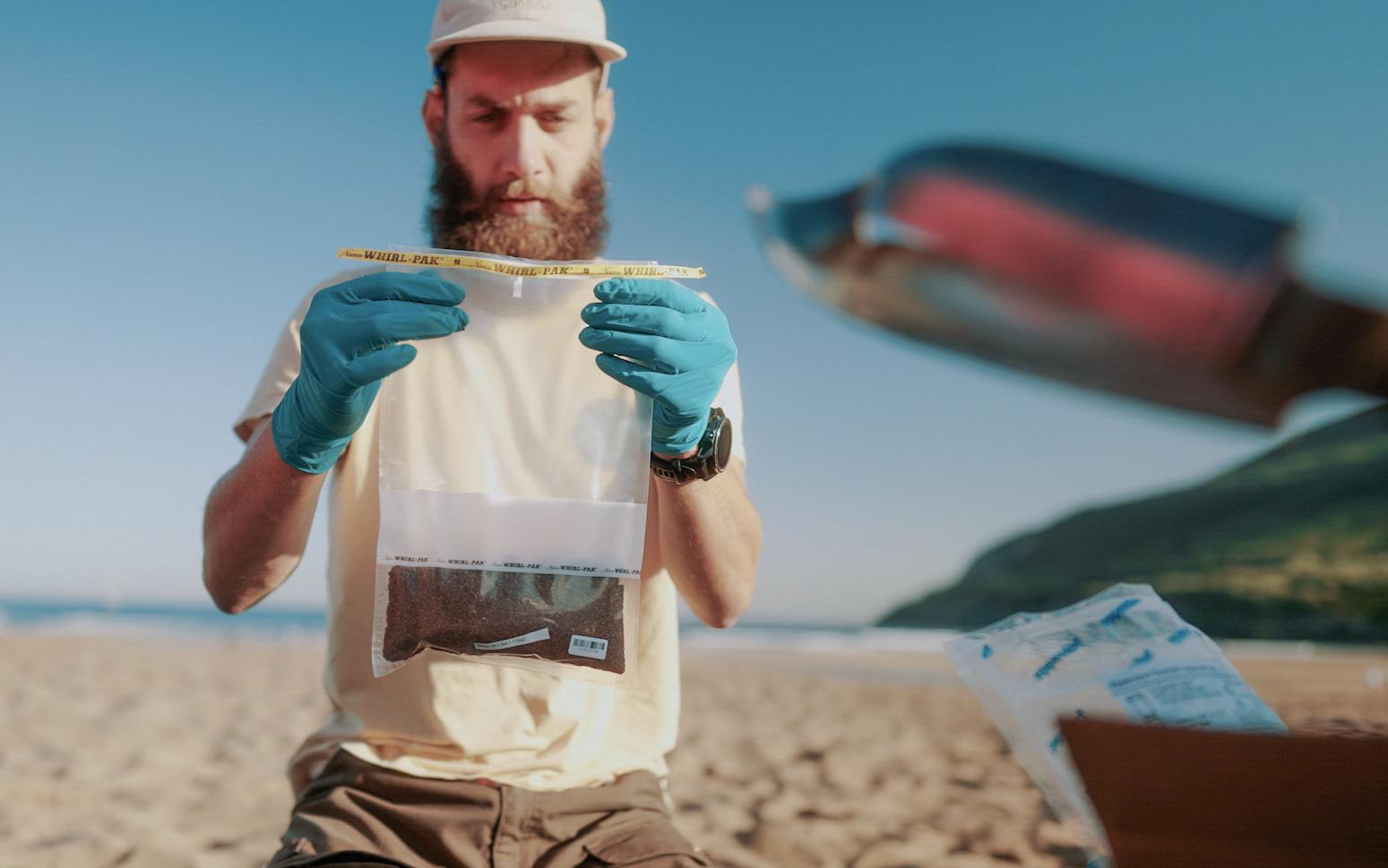 Scientist analyzes a sample at the beach