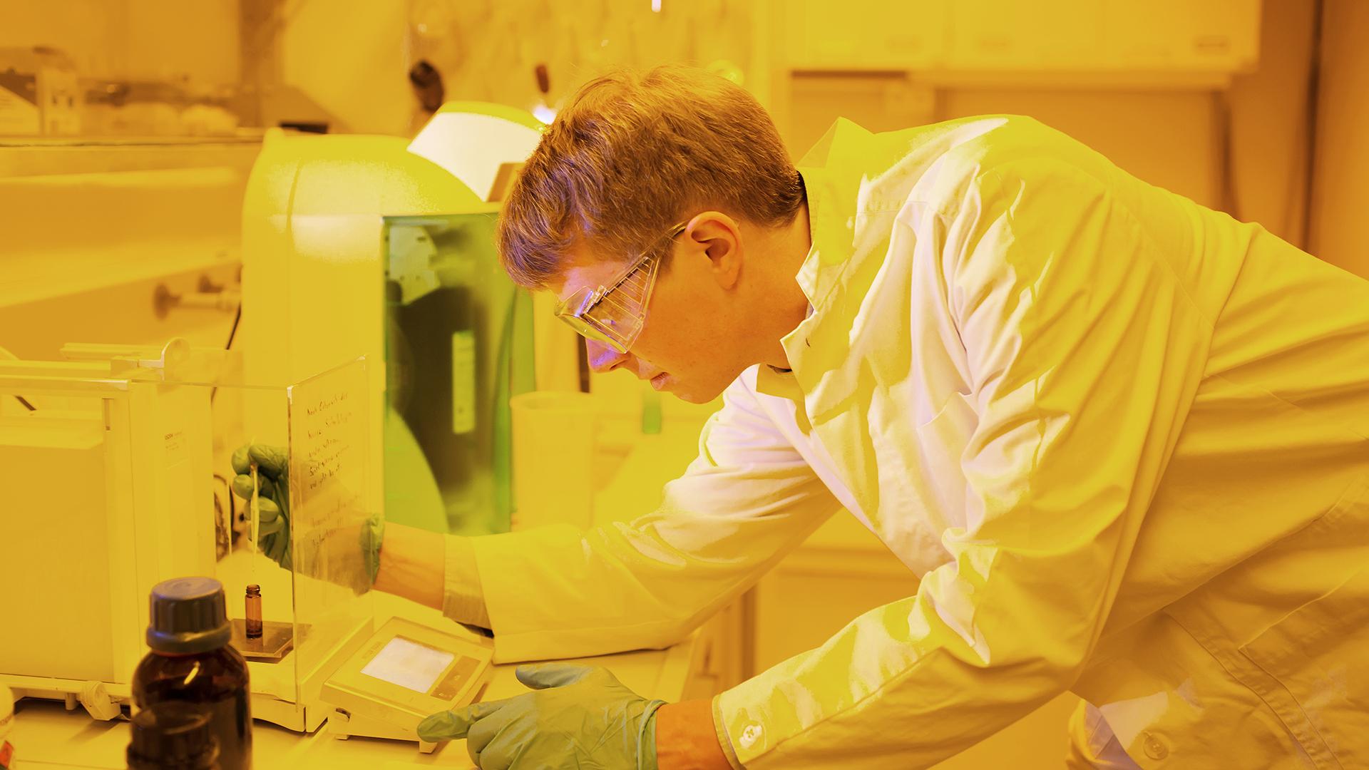 In the chemical lab, Mayer prepares the photoresist for printing.