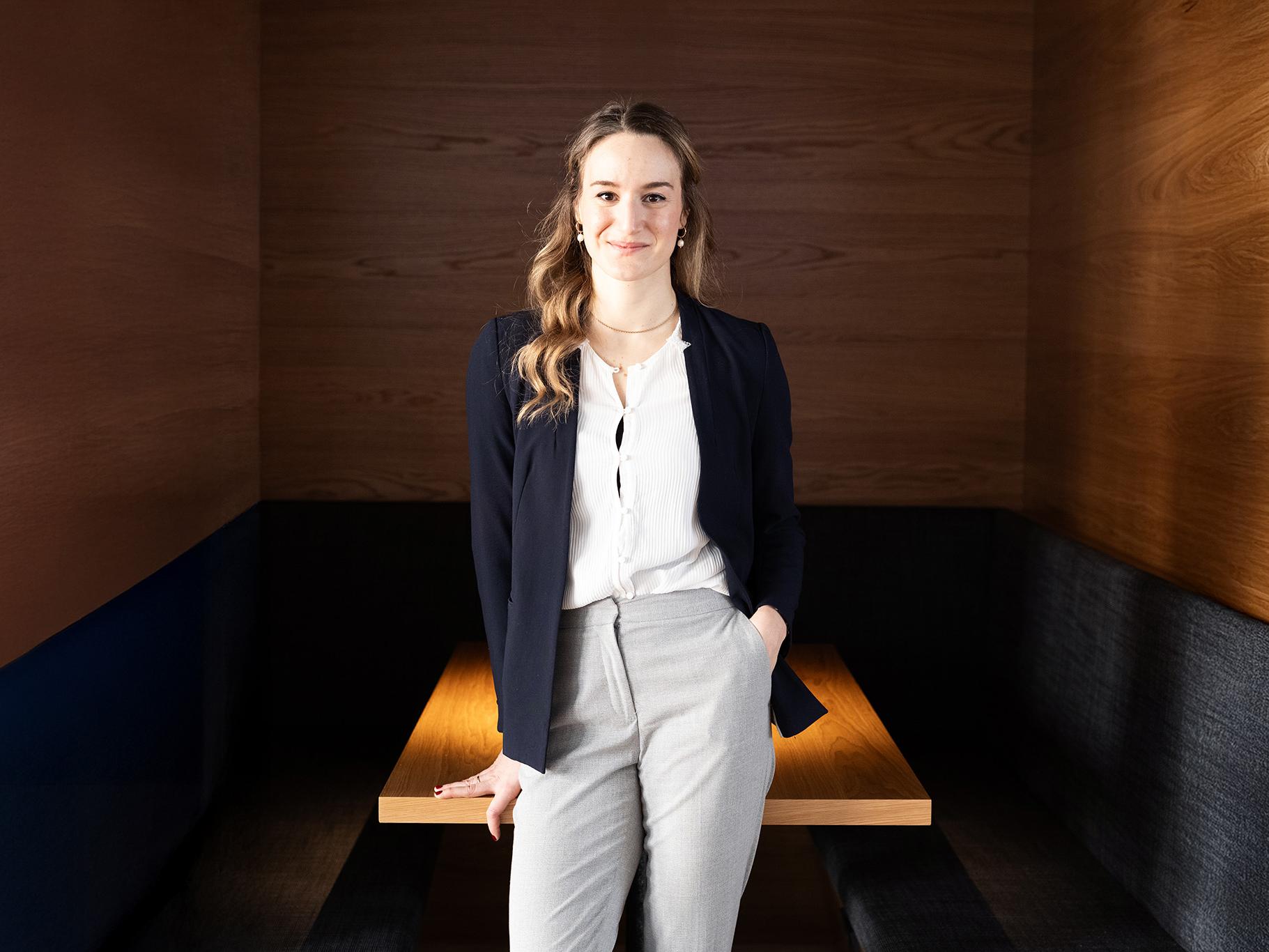Alina Stein standing in front of a desk