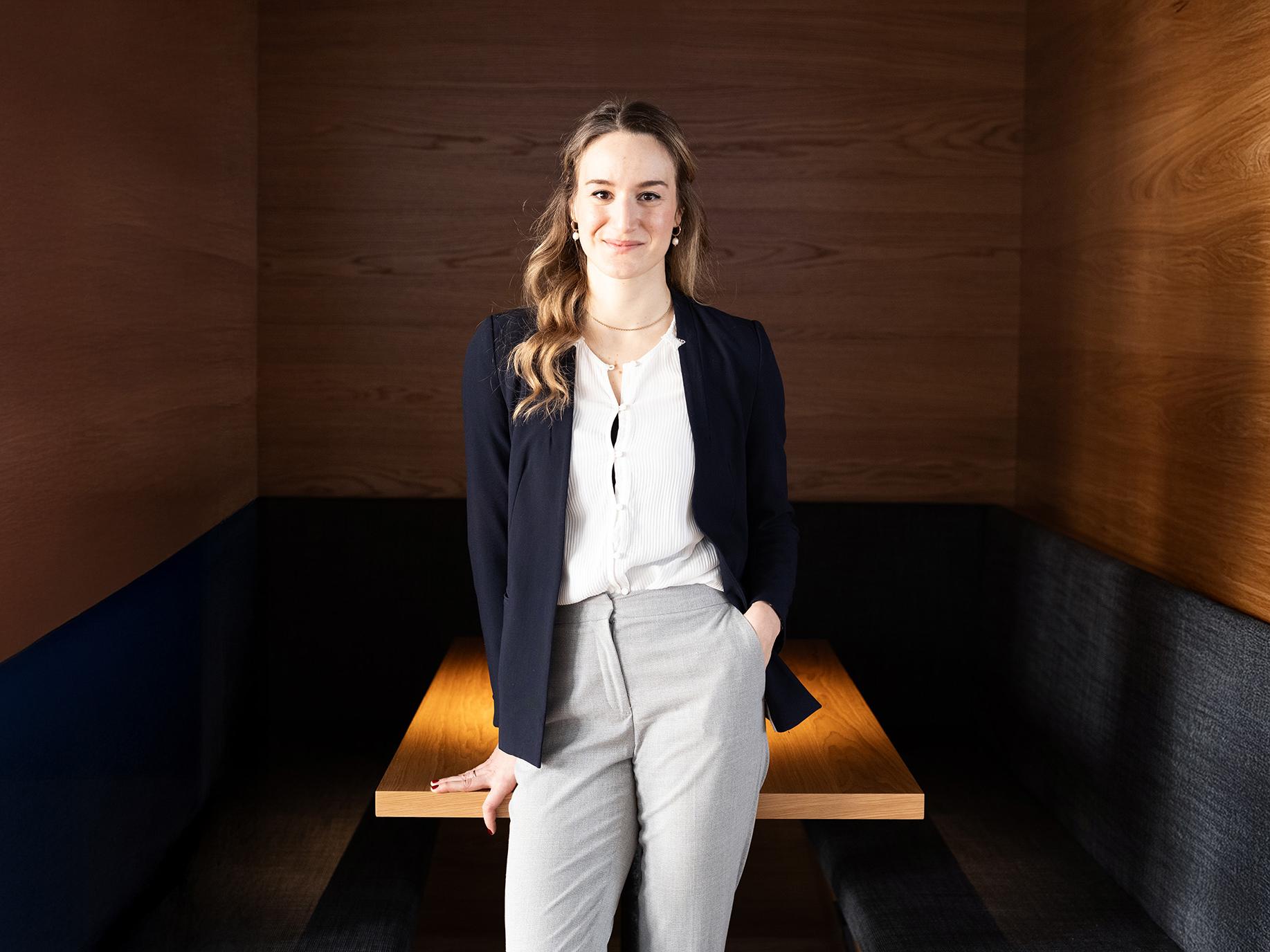 Alina Stein standing in front of a desk