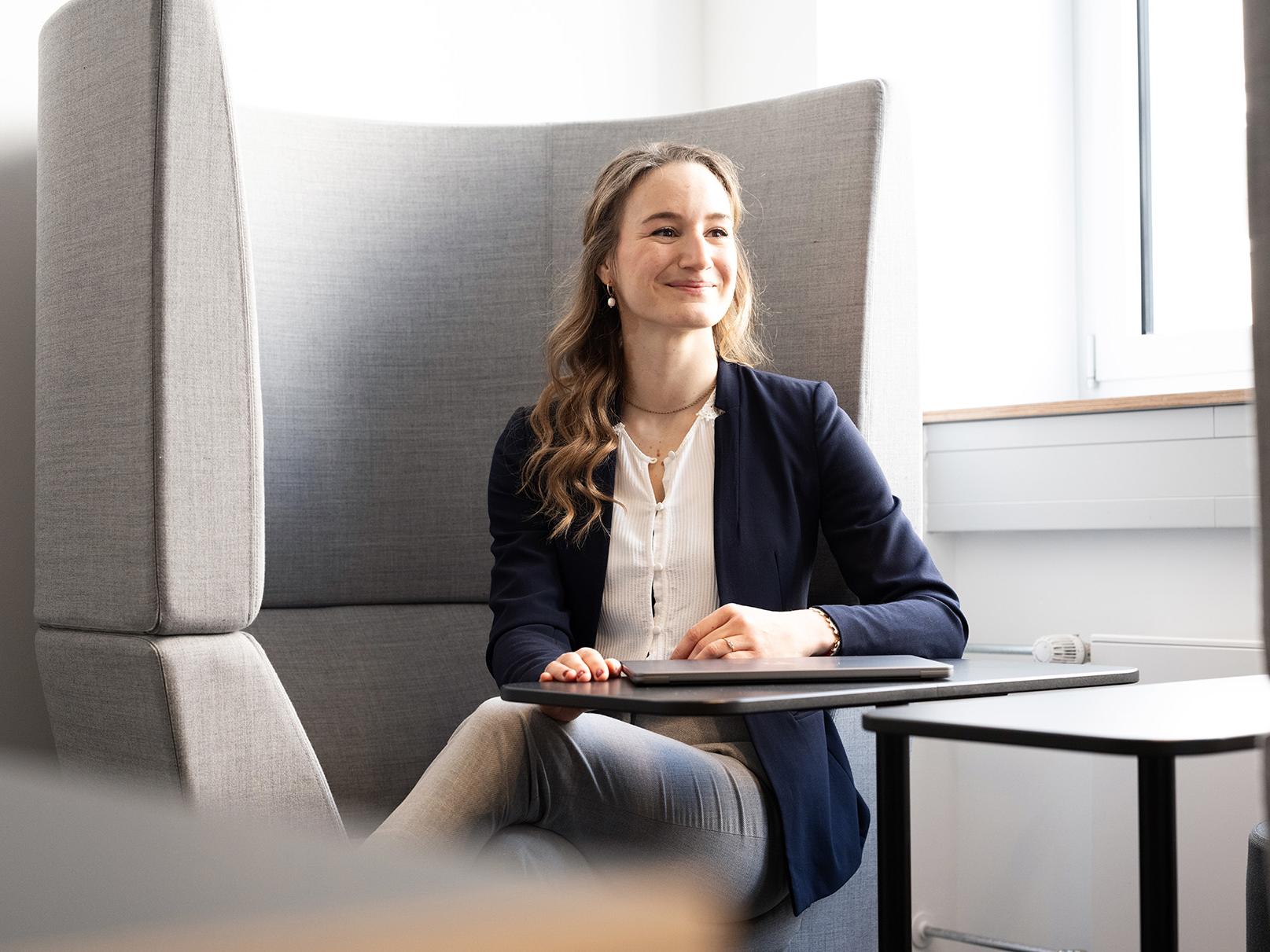 Alina Stein sitting in a meeting space