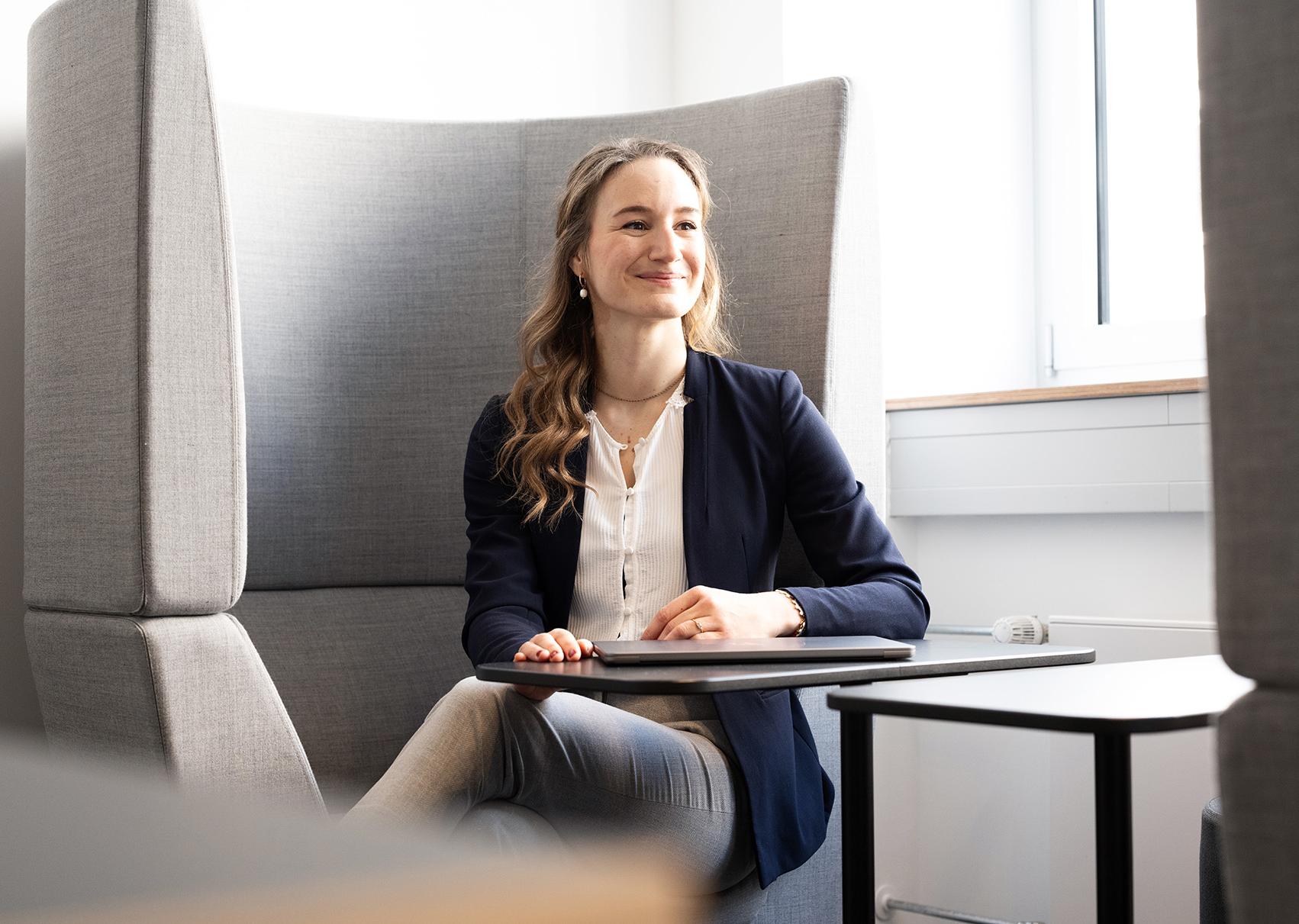 Alina Stein sitting in a meeting space