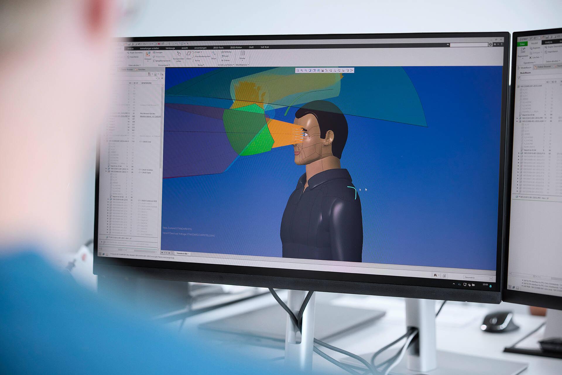 An animated person and their field of vision can be seen on a computer screen, highlighted in color.