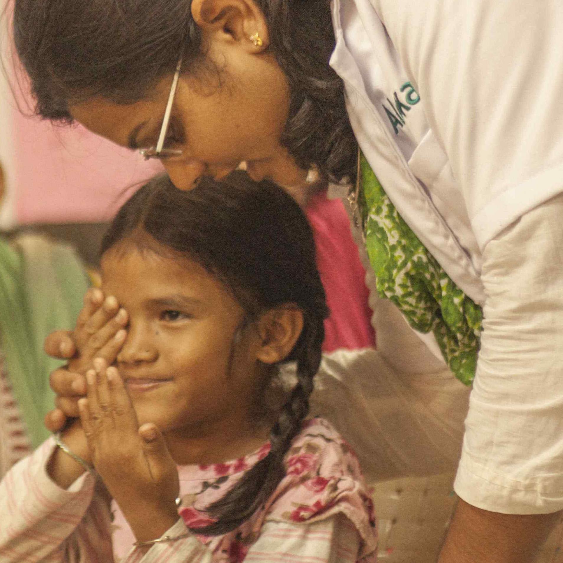 Aloka vision programme woman is testing a girls eyes