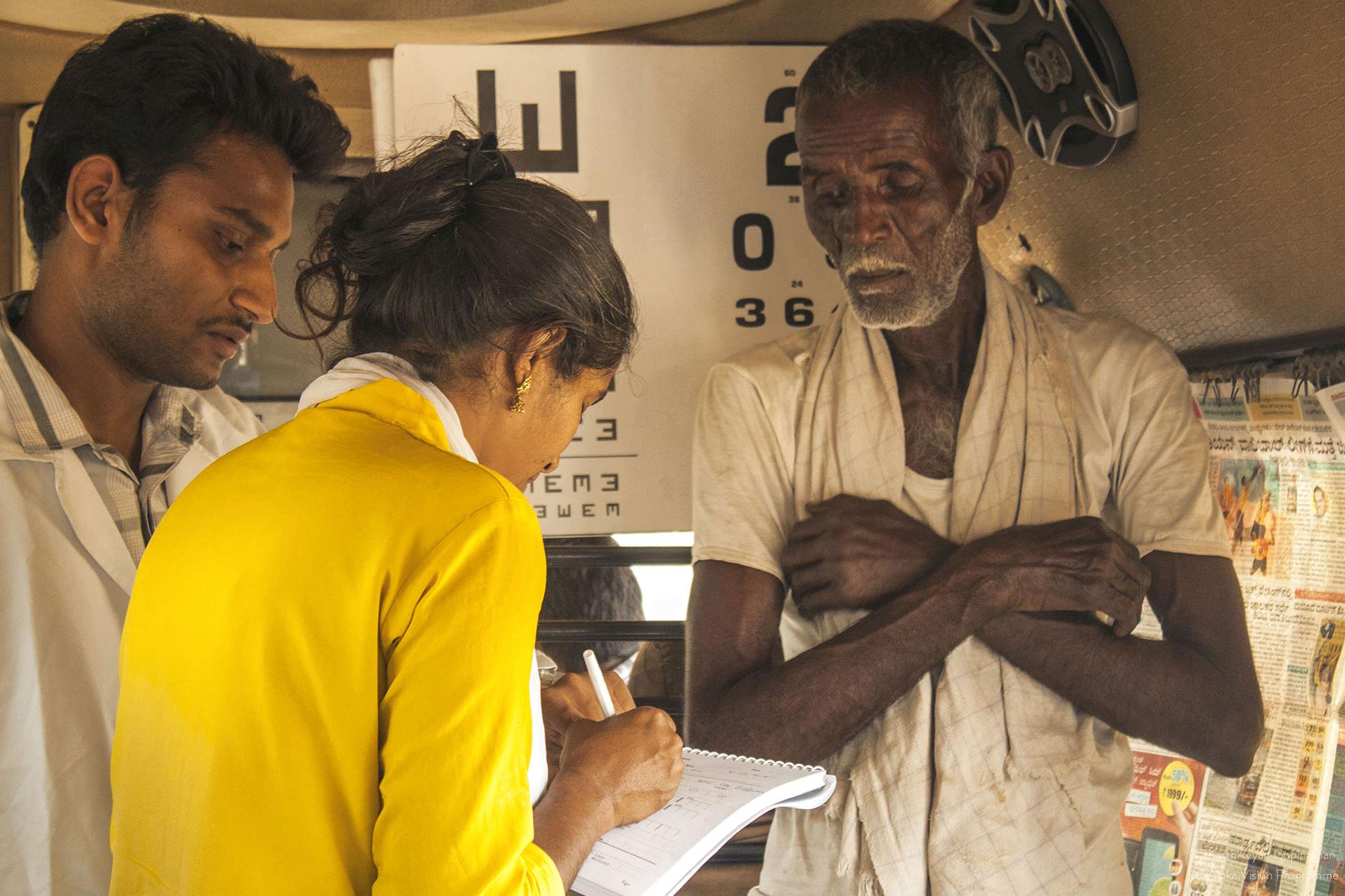 Old man talking to doctor