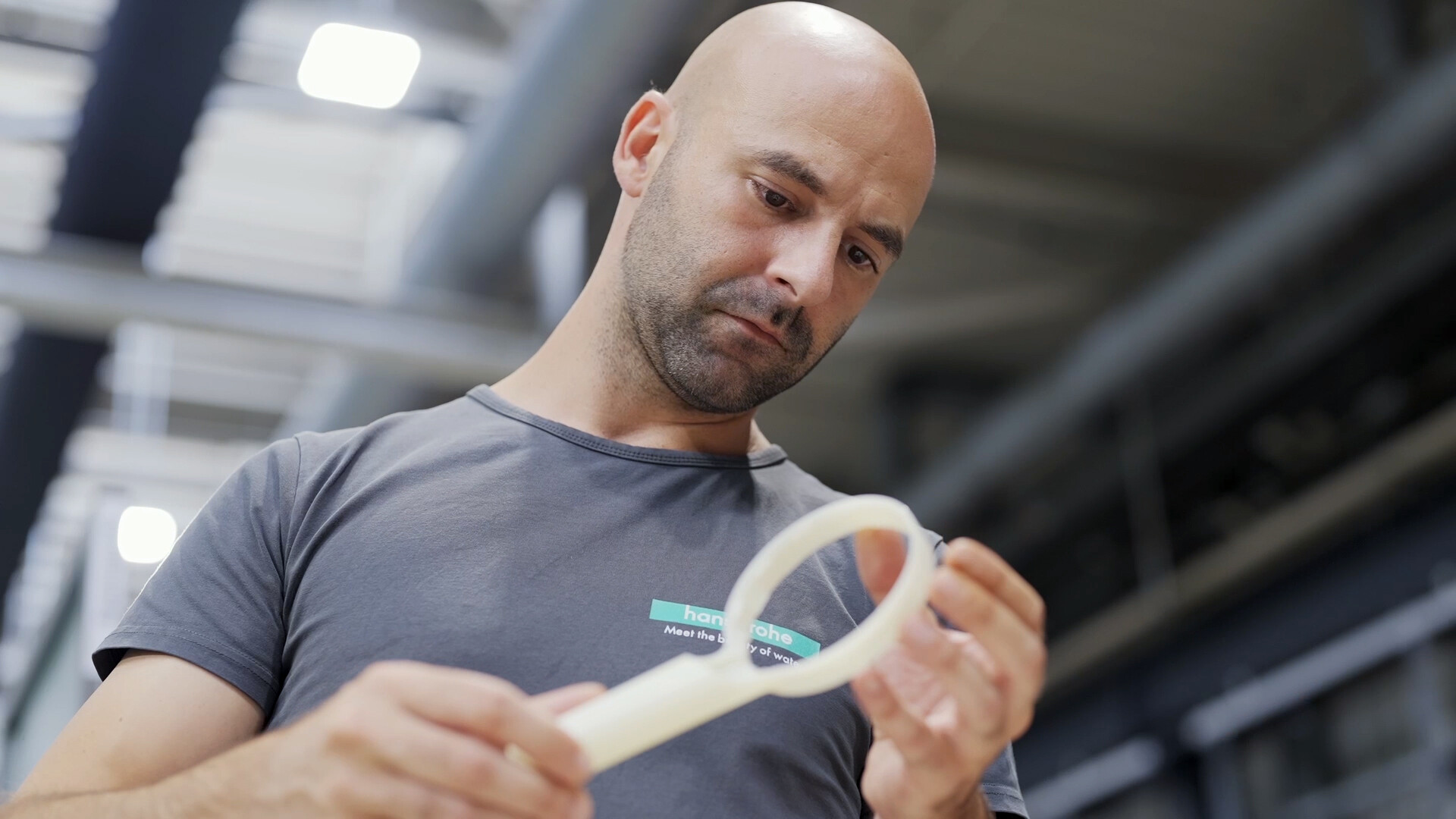 Philipp Alender checks the quality of a shower head