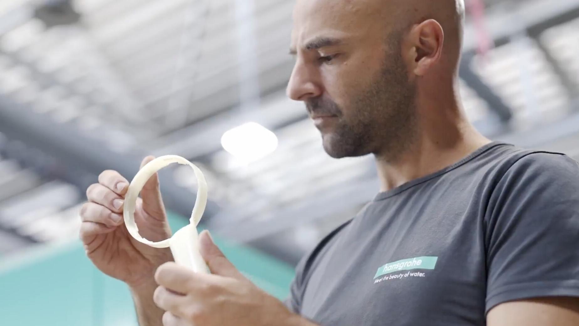 Philipp Alender checks the quality of a shower head