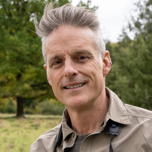 Portrait of Nick Baker. He looks straight into the camera and has a friendly smile