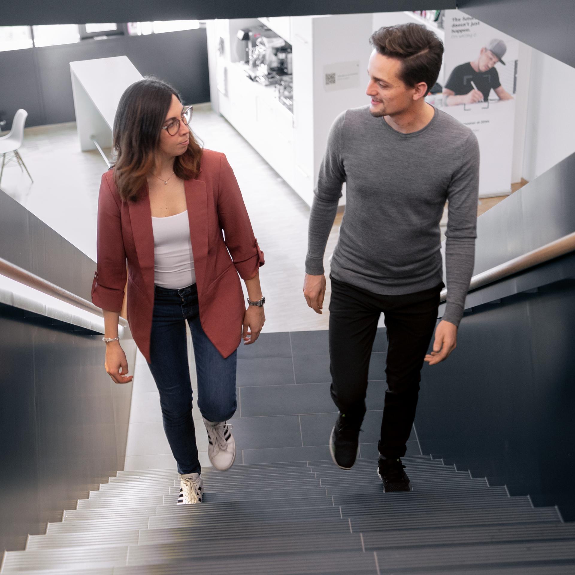 Dr. Eleonora Tagliabue and Dr. Daniel Reichard on the stairs