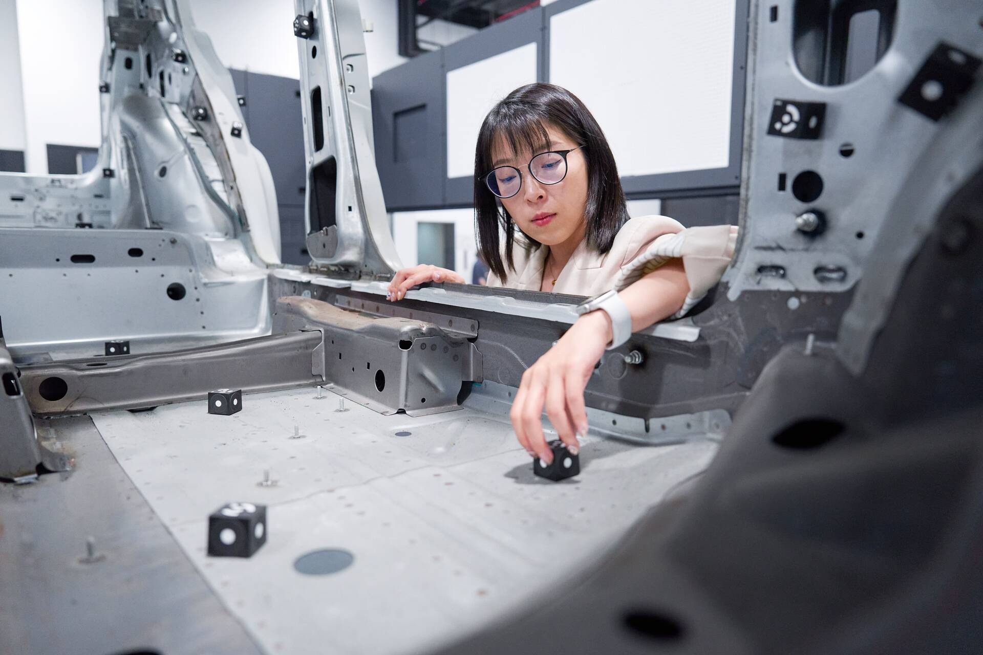 Yuqing Bai working on metrology eqipment in the lab