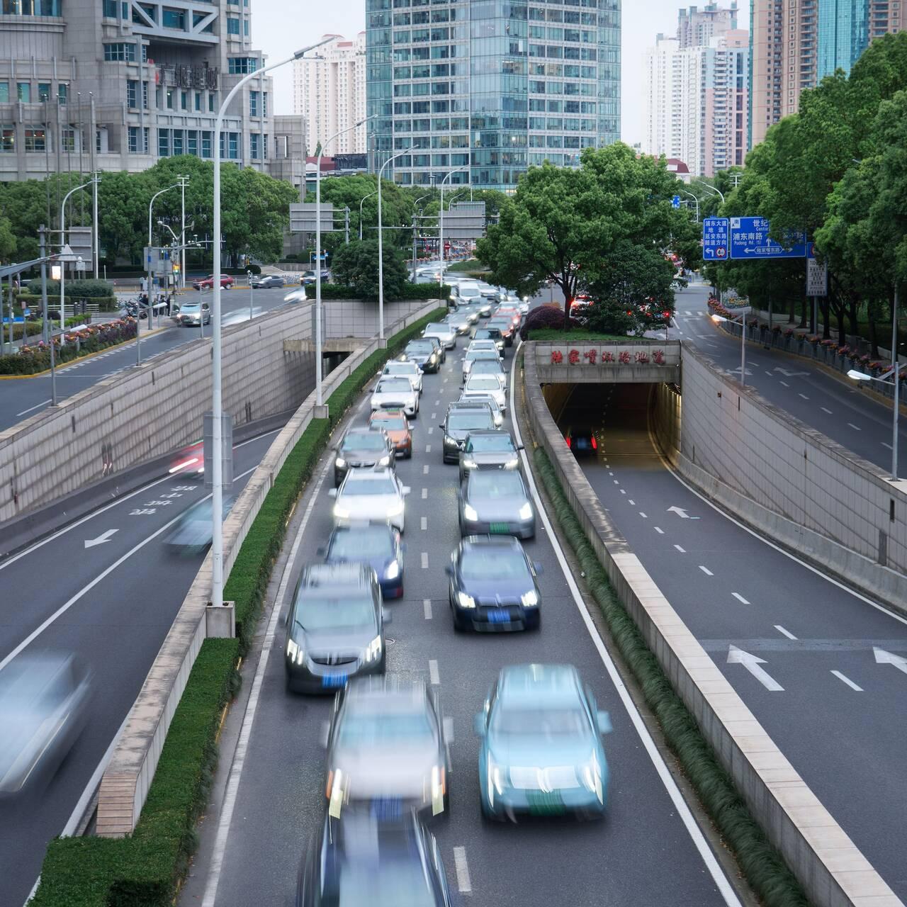 Cars travelling along a road in Shanghai