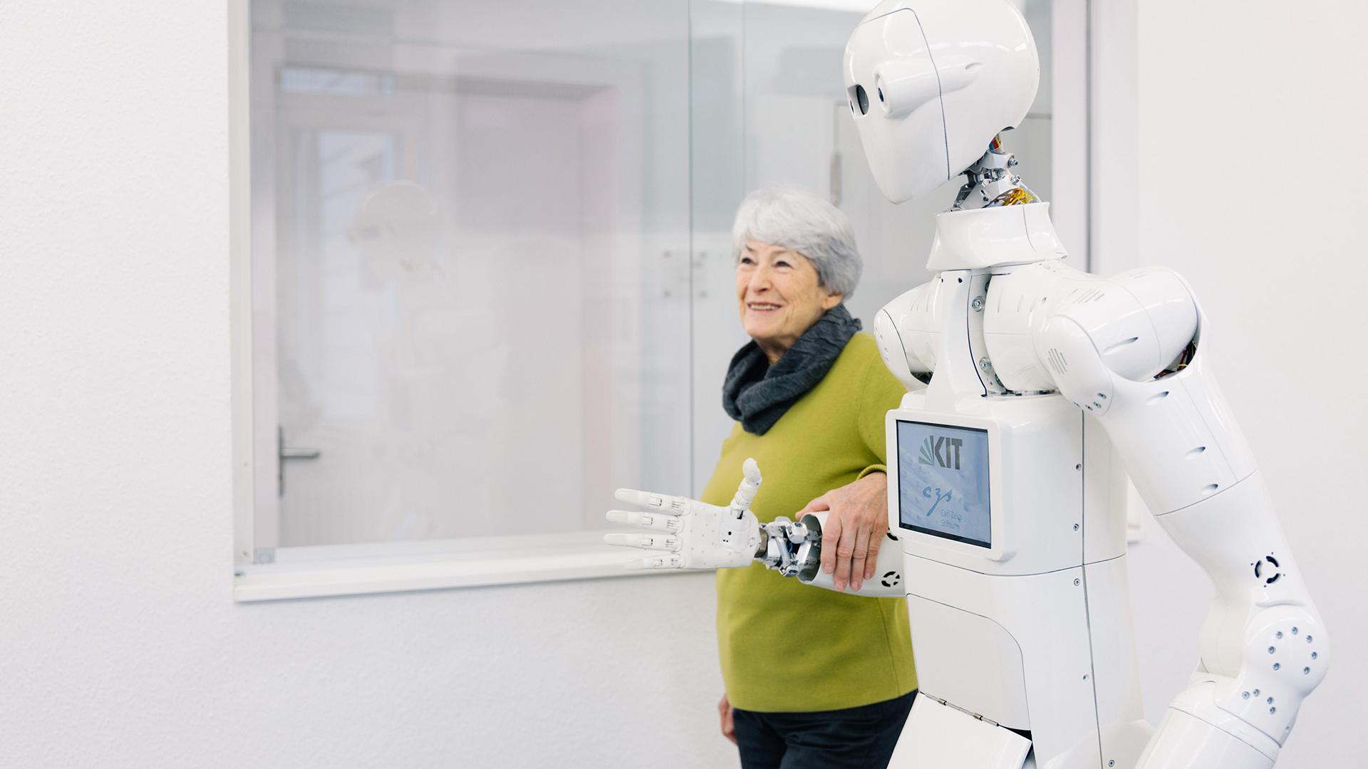 A robot guides a person through a building