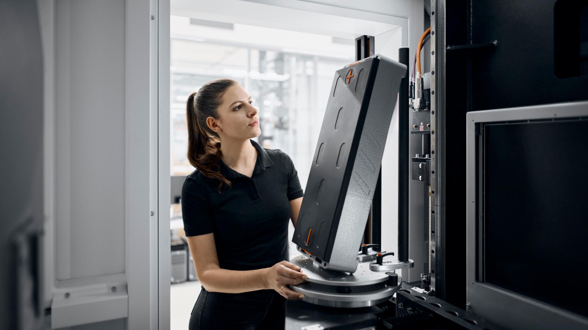 A person is managing the battery cell production and assembly