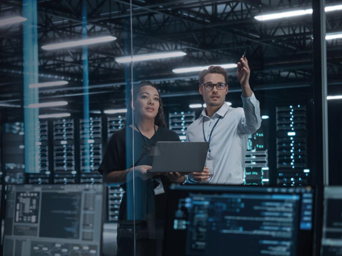 IT professionals in modern server room