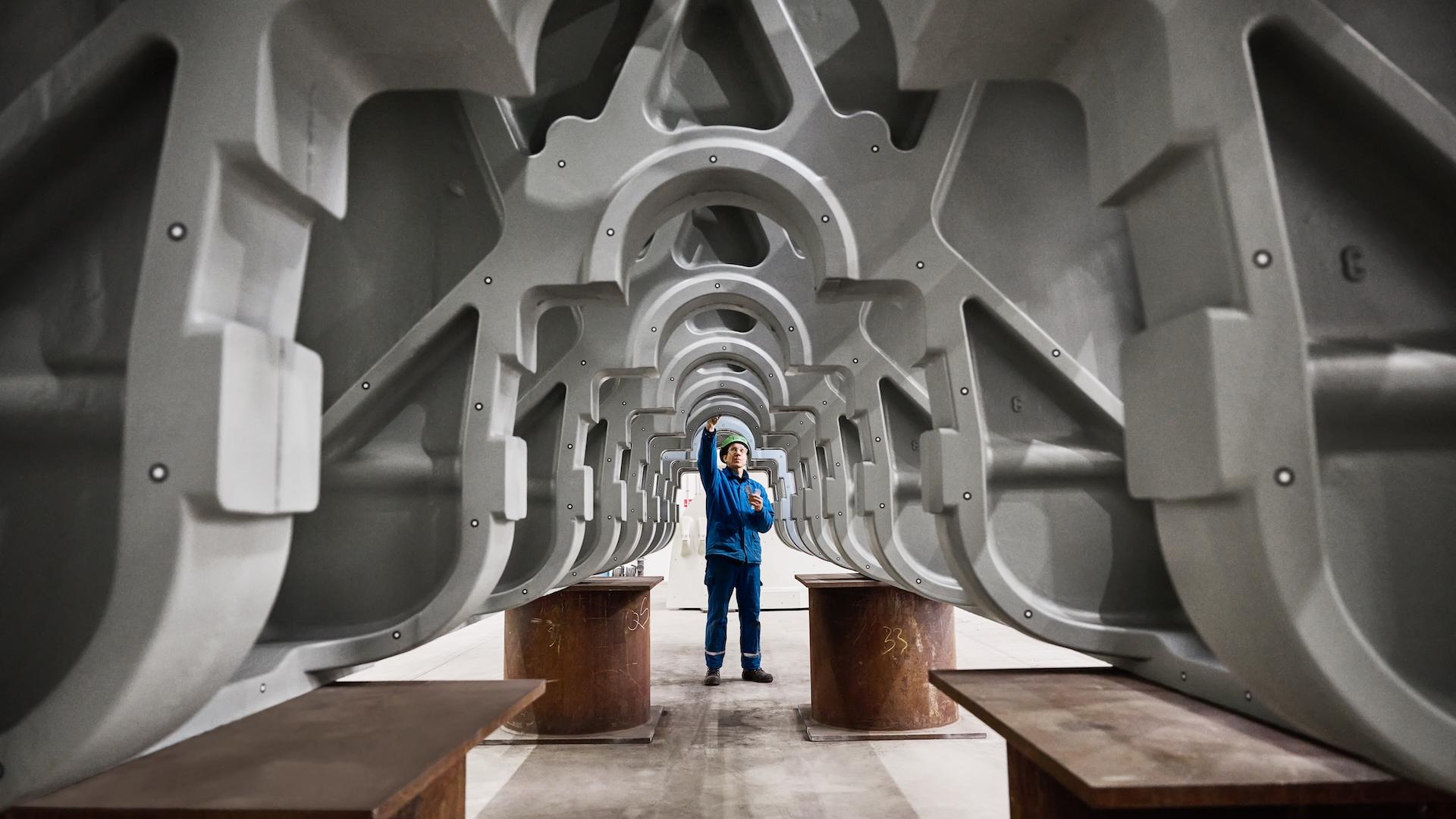 Engineer inspecting industrial metal framework