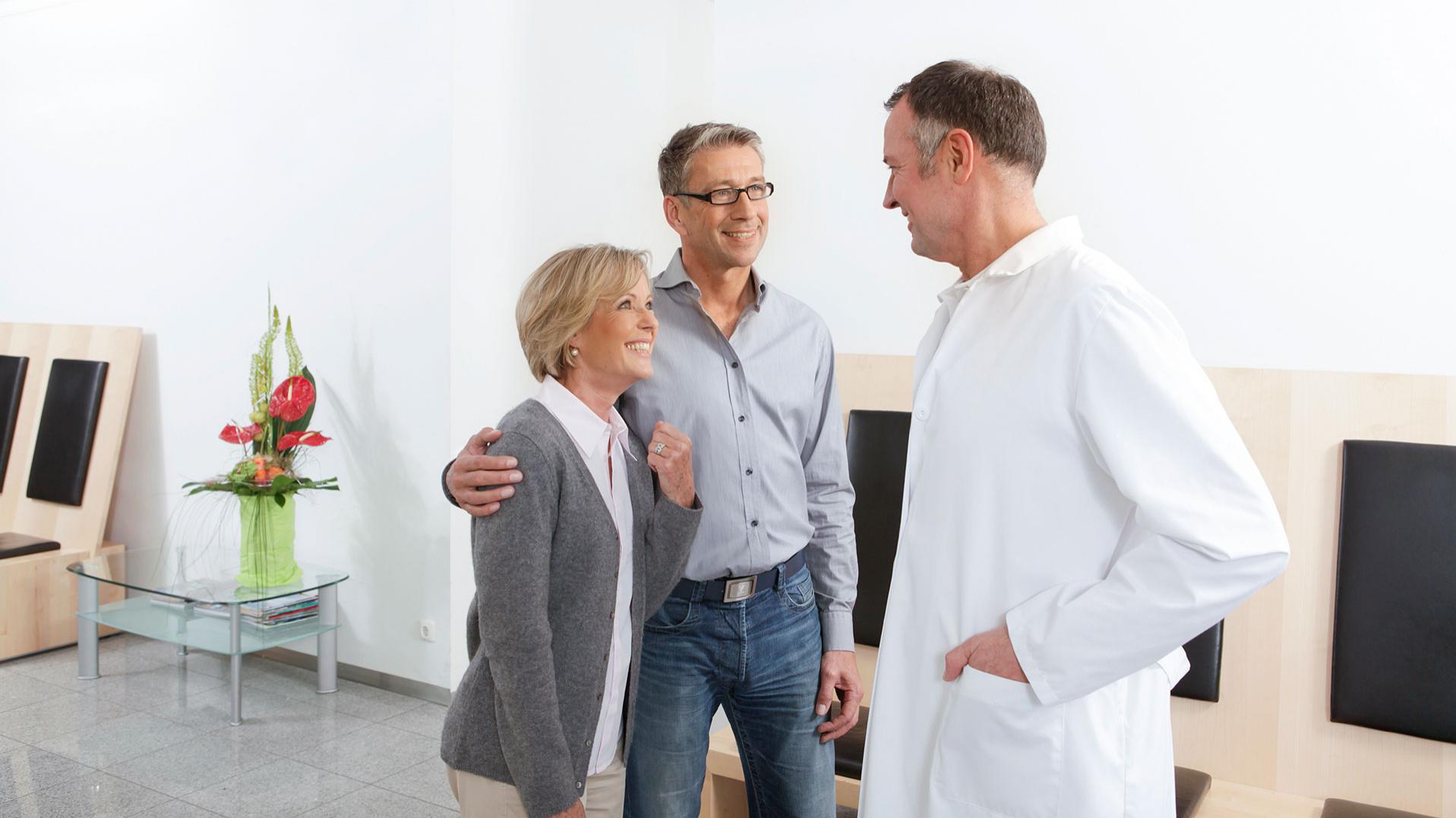 Doctor informing patients about cataract surgery procedures.