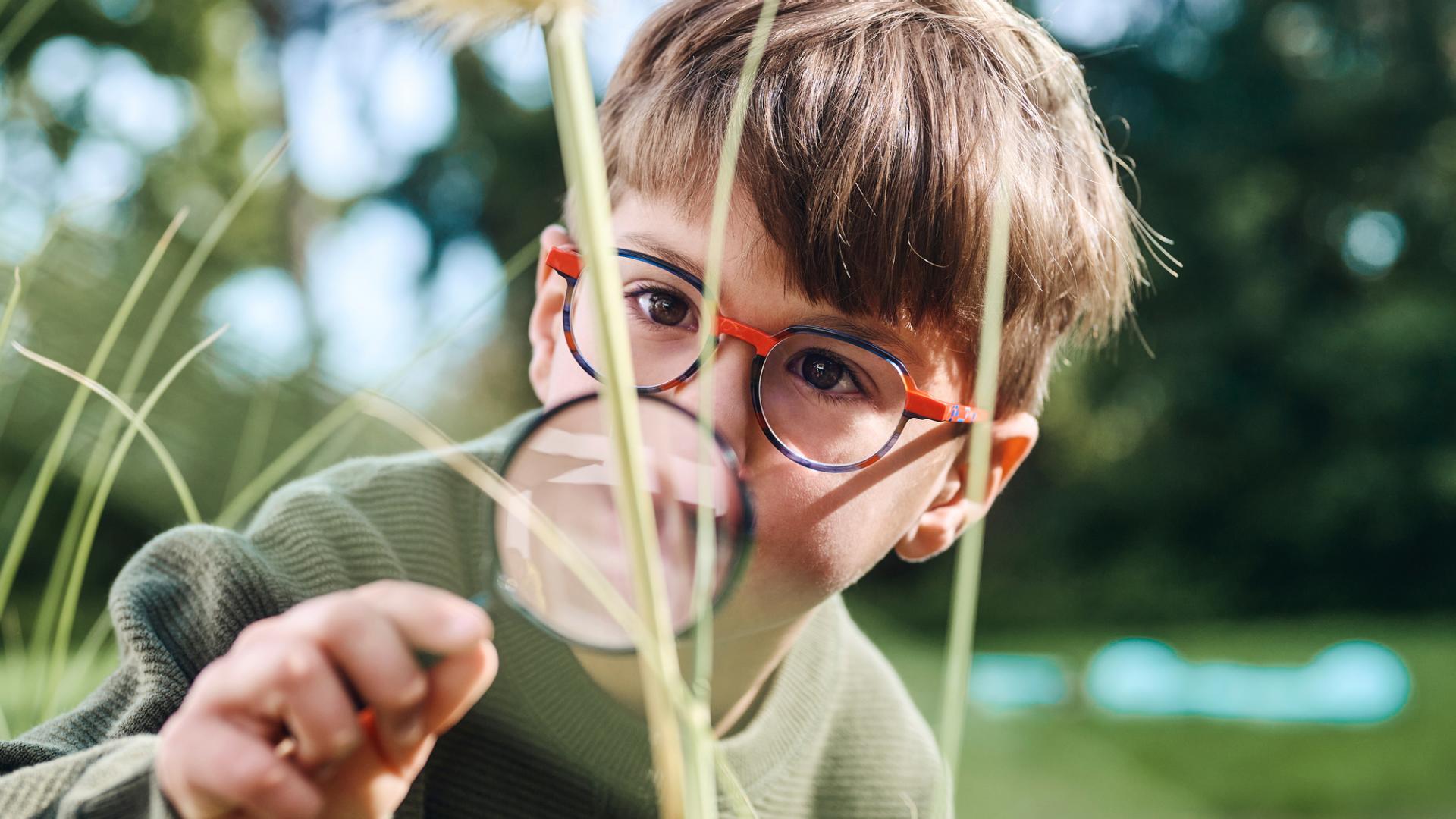 Child with Magnifier