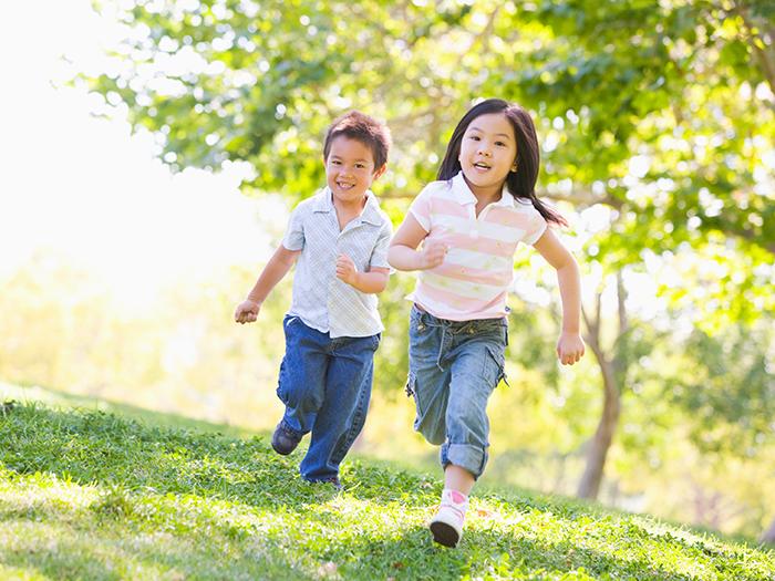 two children running outside