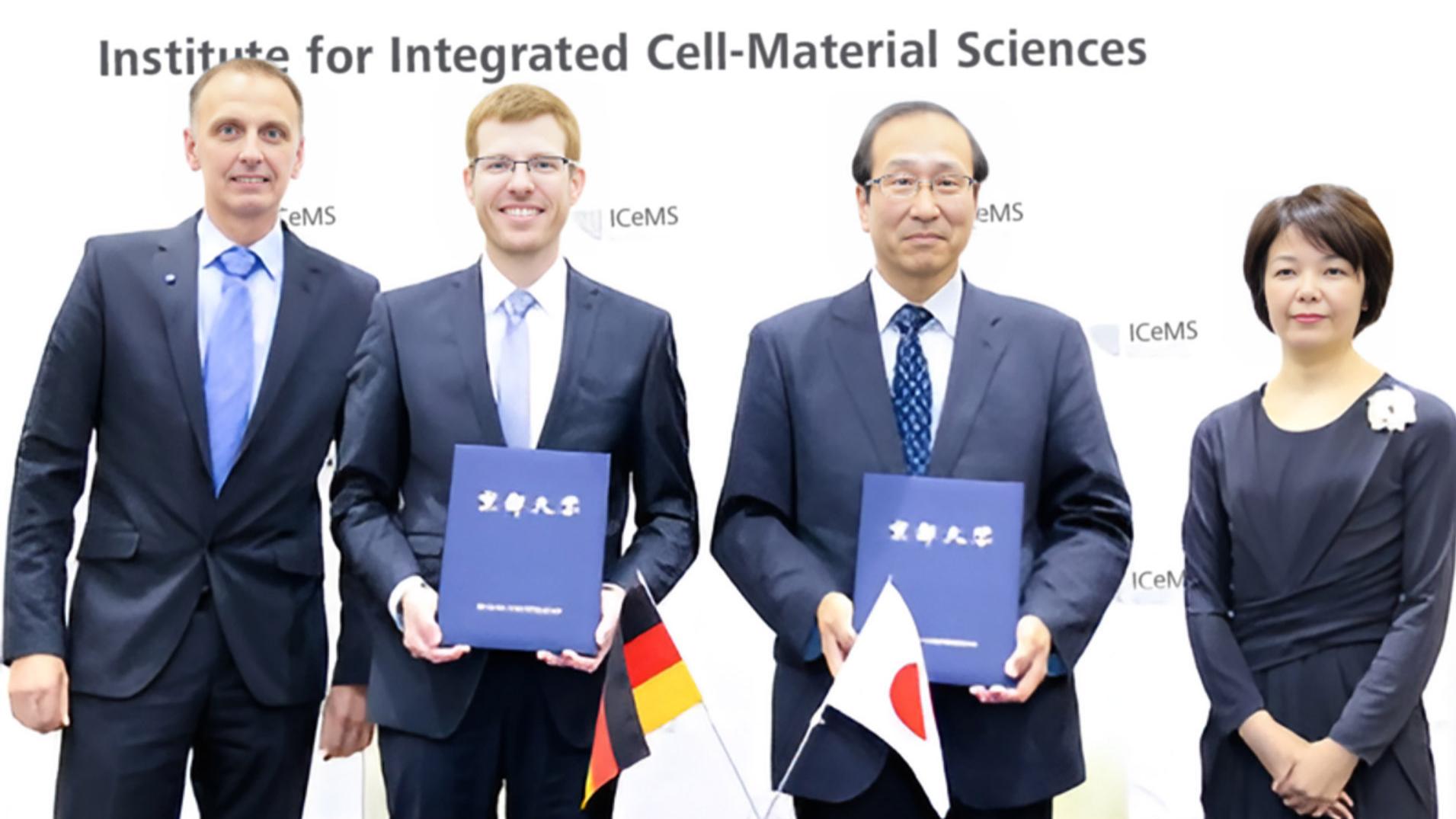 Dr. Bernhard Zimmermann, Head of Life Sciences Microscopy at ZEISS, and Dr. Michael Albiez, Head of ZEISS Research Microscopy Solutions, together with iCeMS Director Prof. Susumu Kitagawa and Deputy Director Prof. Mineko Kengaku at the Opening of the ZEISS-iCeMS Innovation Core in 2019.