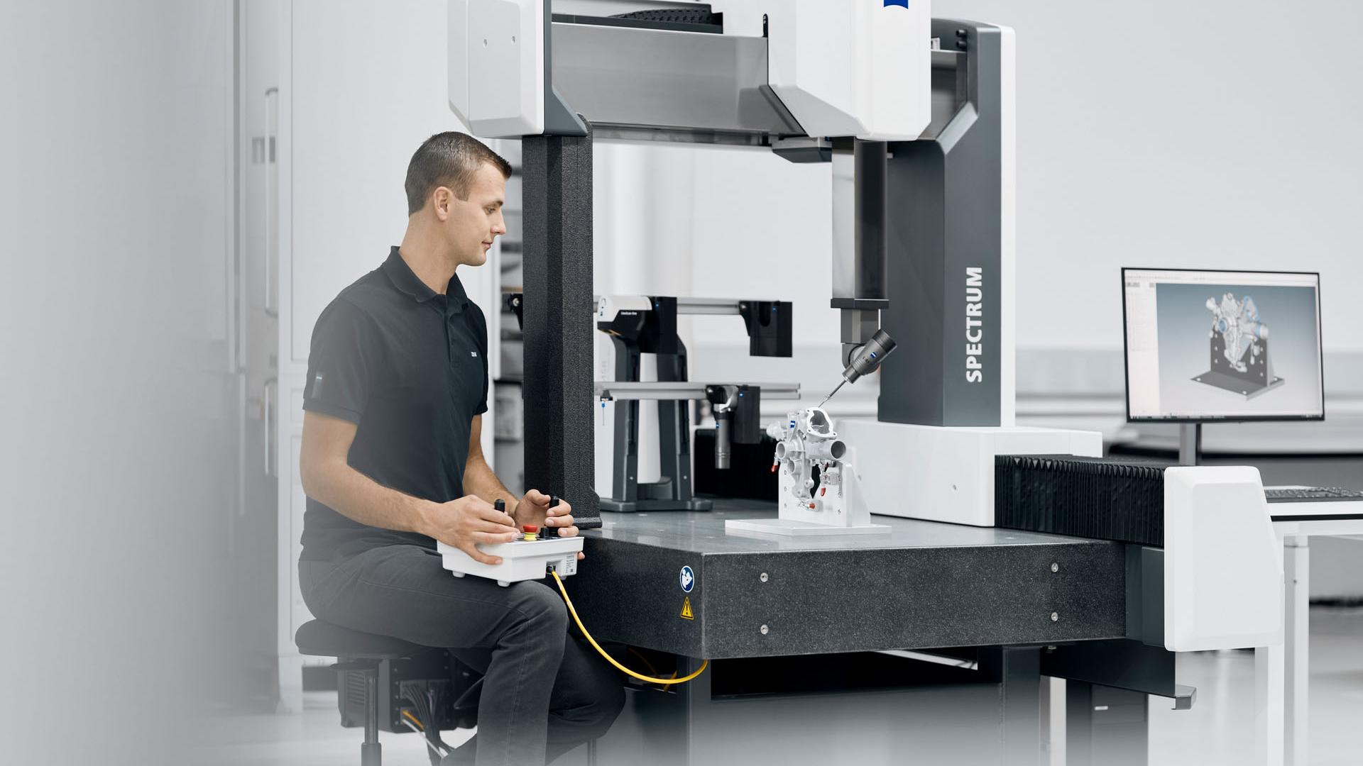 Man working on a component with the ZEISS SPECTRUM Scanning System