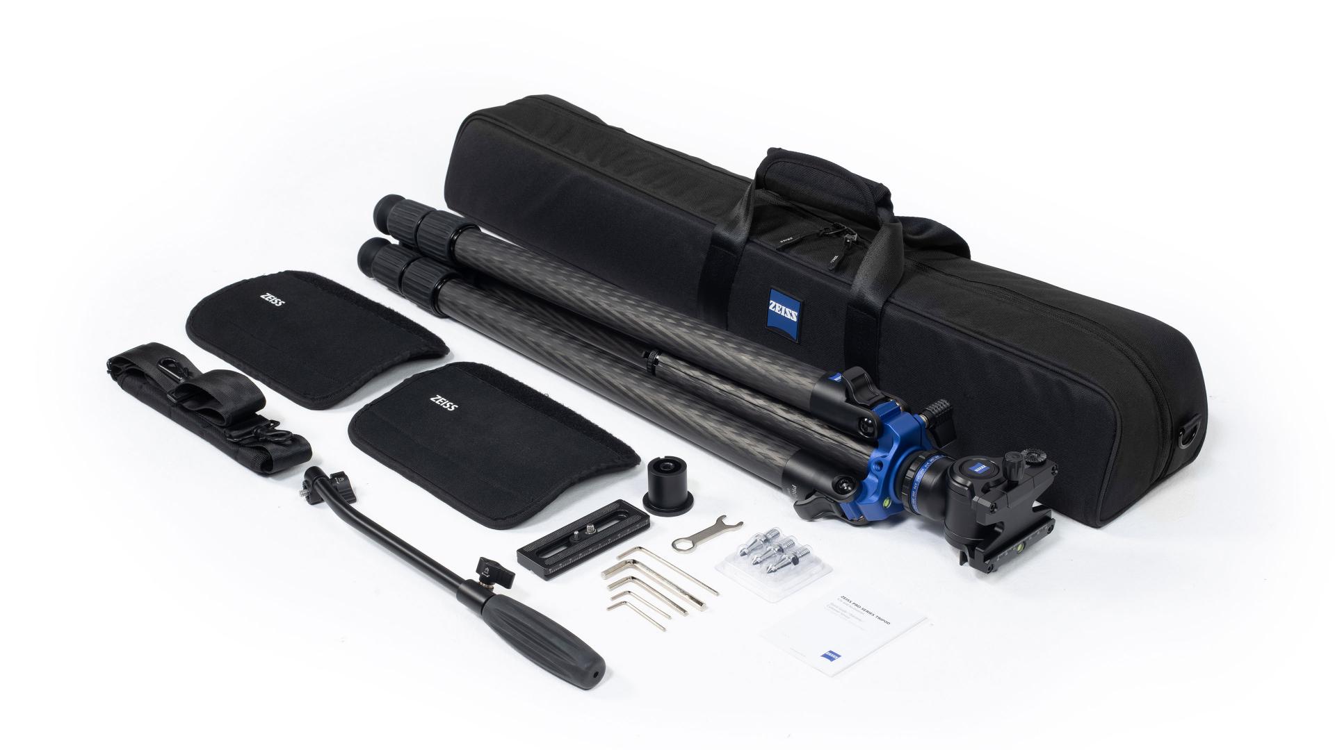 Carbon fiber tripod kit with accessories, including a carry case, mounting tools, handle, and padded components, all branded with ZEISS.