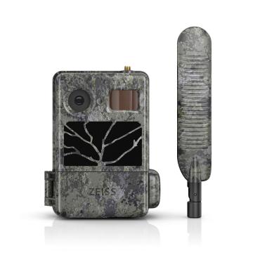 Camouflaged ZEISS trail camera with tree-branch design next to a matching external antenna.