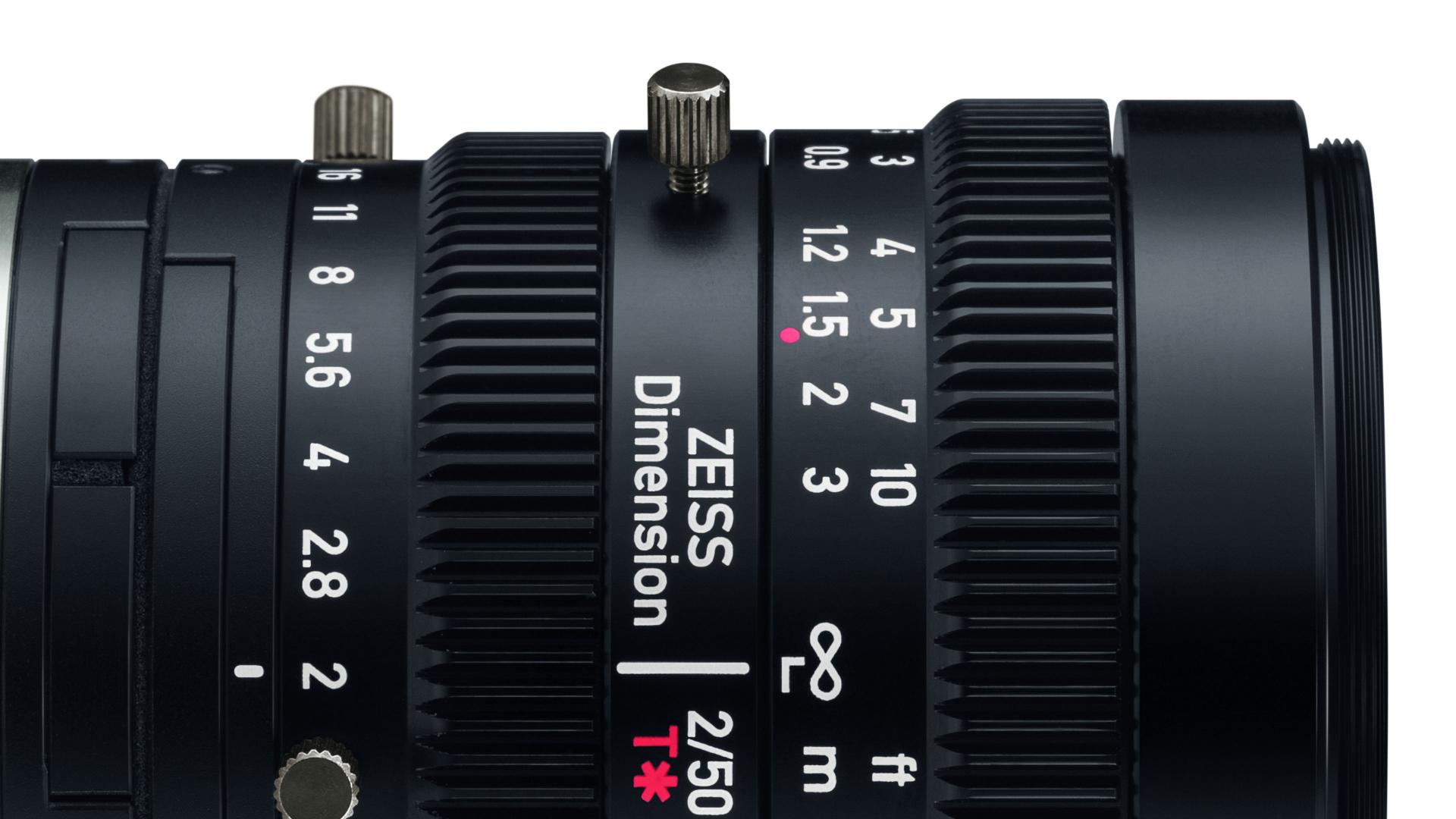Close-up view of a ZEISS Dimension 2/50 T* camera lens showing detailed focus and aperture markings.