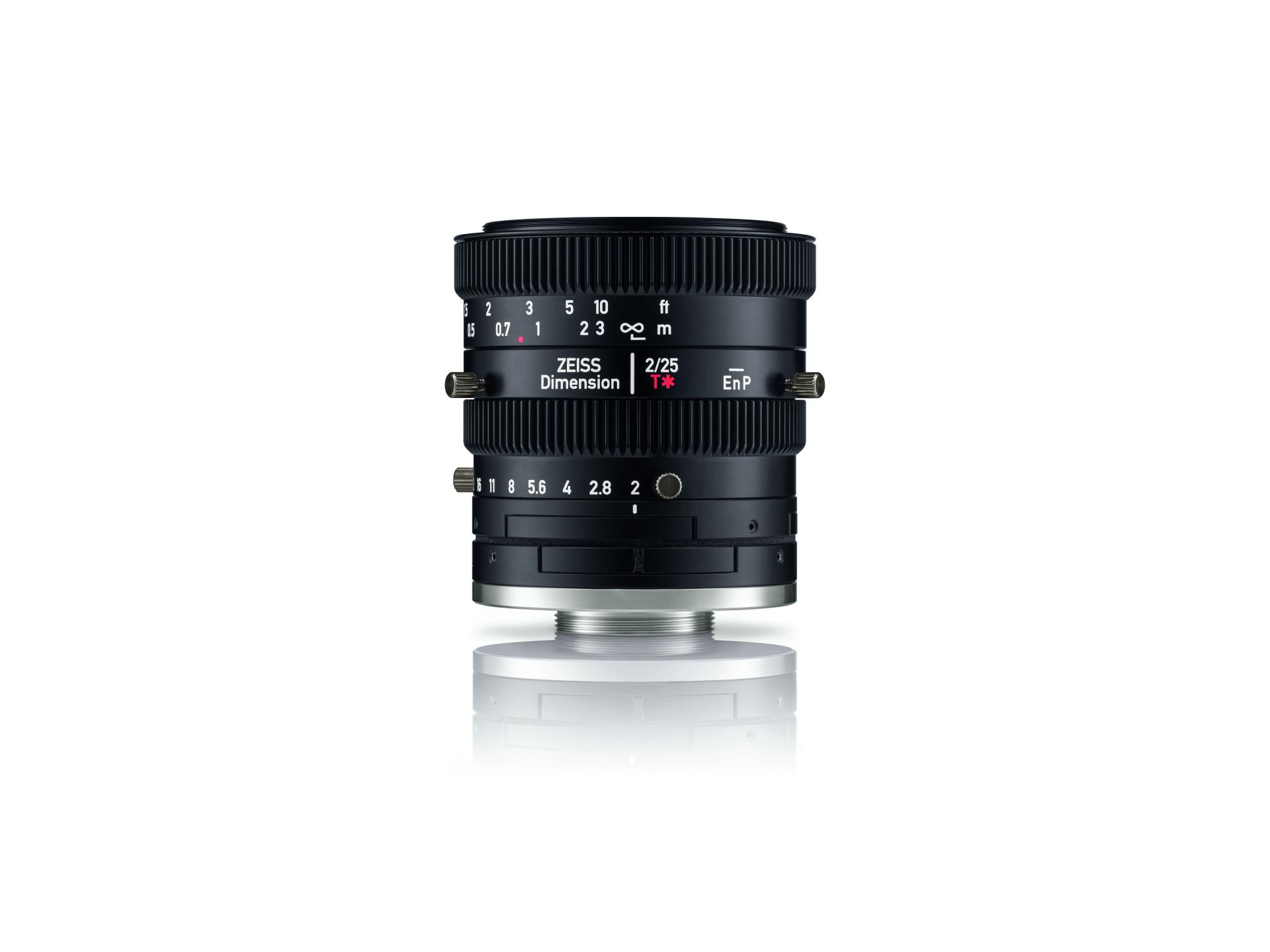Black ZEISS Dimension lens with manual focus and aperture adjustment rings, displayed upright on a white background.