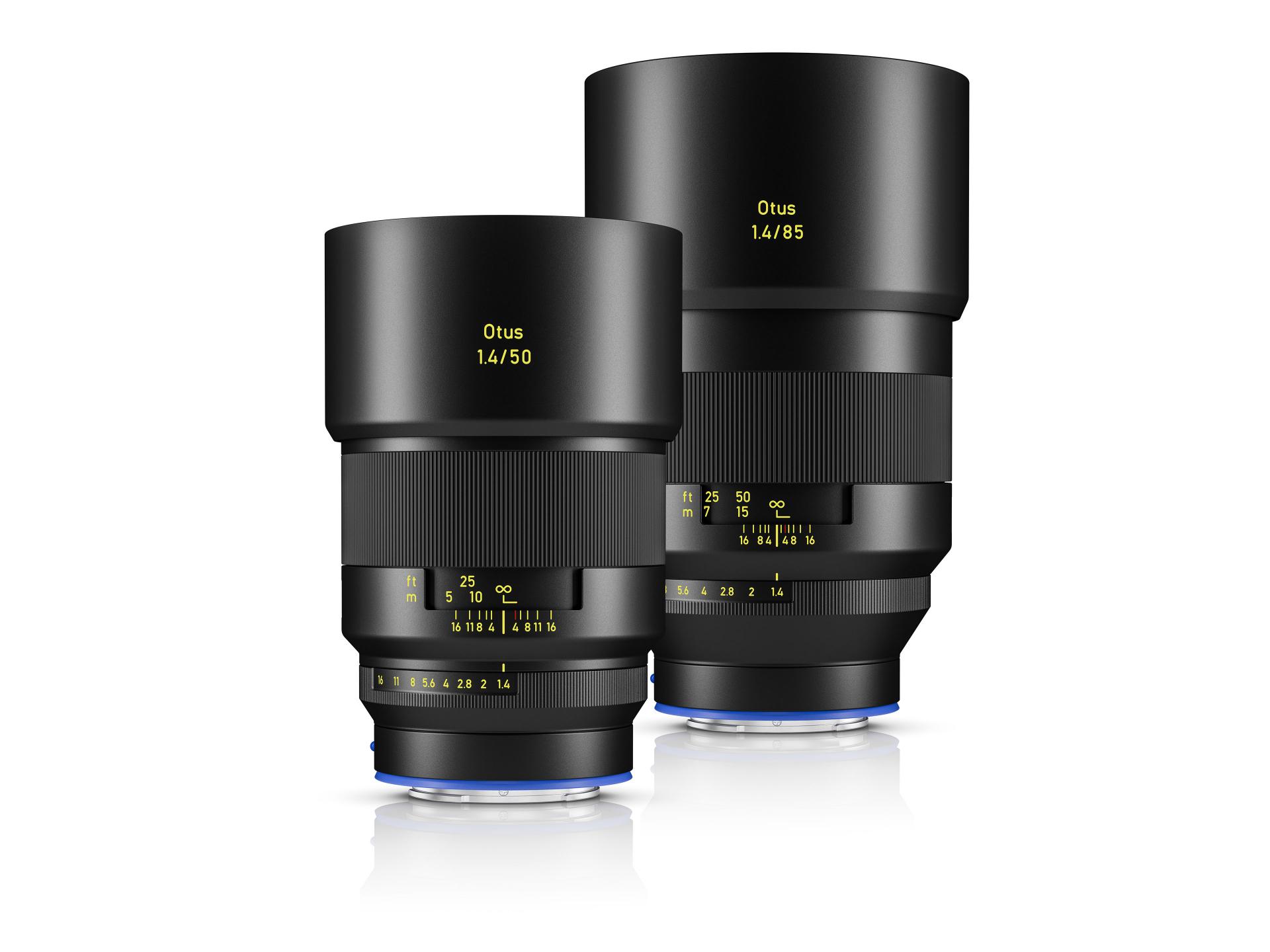 Two ZEISS Otus 1.4/50 camera lenses are displayed side by side, showcasing their sleek black design and detailed focus markings.