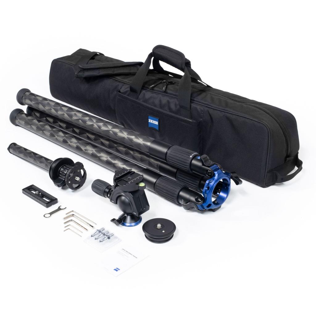 Carbon fiber tripod kit with multiple components, including a tripod head, mounting accessories, instruction manual, and a black carrying case featuring the ZEISS logo.