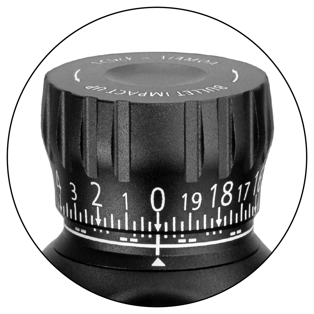 Close-up image of a ZEISS riflescope elevation turret with precision adjustment markings and a textured grip.