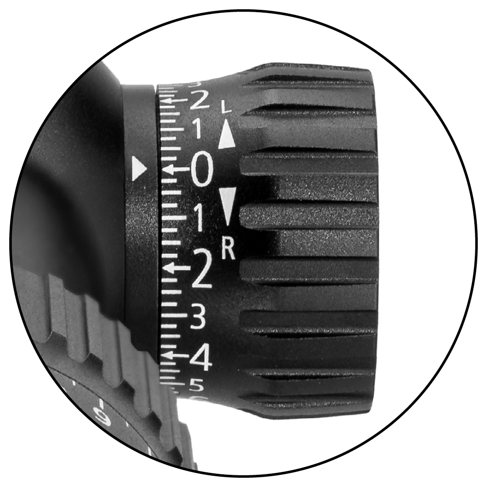 Close-up view of a precision adjustment dial with numerical markings and directional arrows on a ZEISS optical instrument.