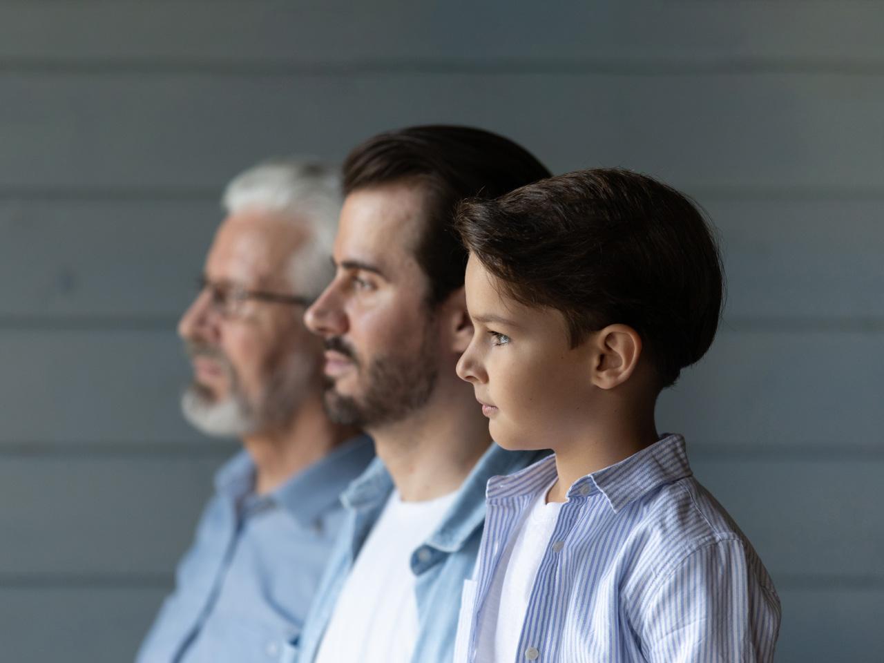 Side profile of three generations: grandfather, father, and son.