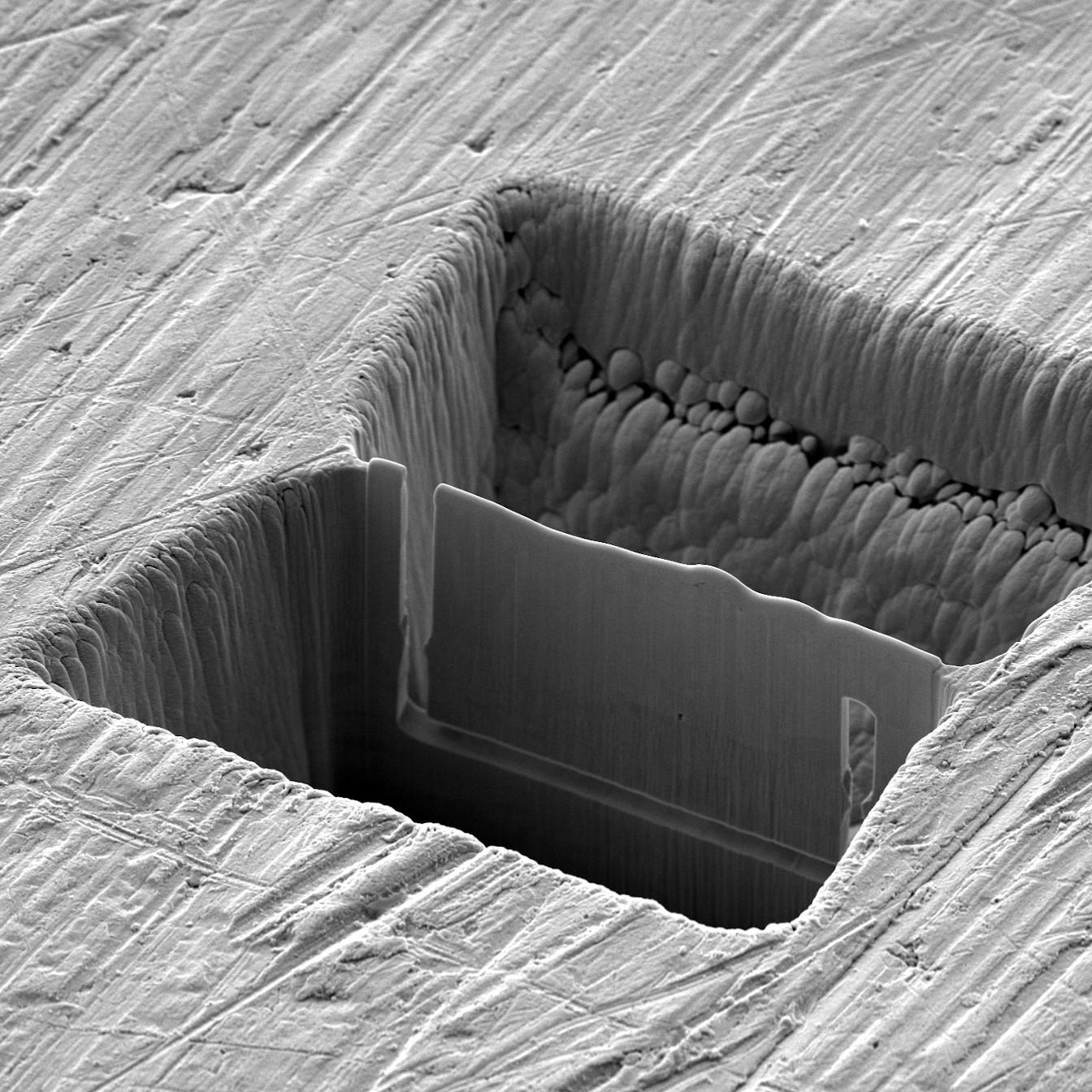 Multi-site lamella preparation of a 3 x 2 array of laser- machined chunks followed by FIB millingfor precise thinning to produce a < 2 µm TEM lamella.