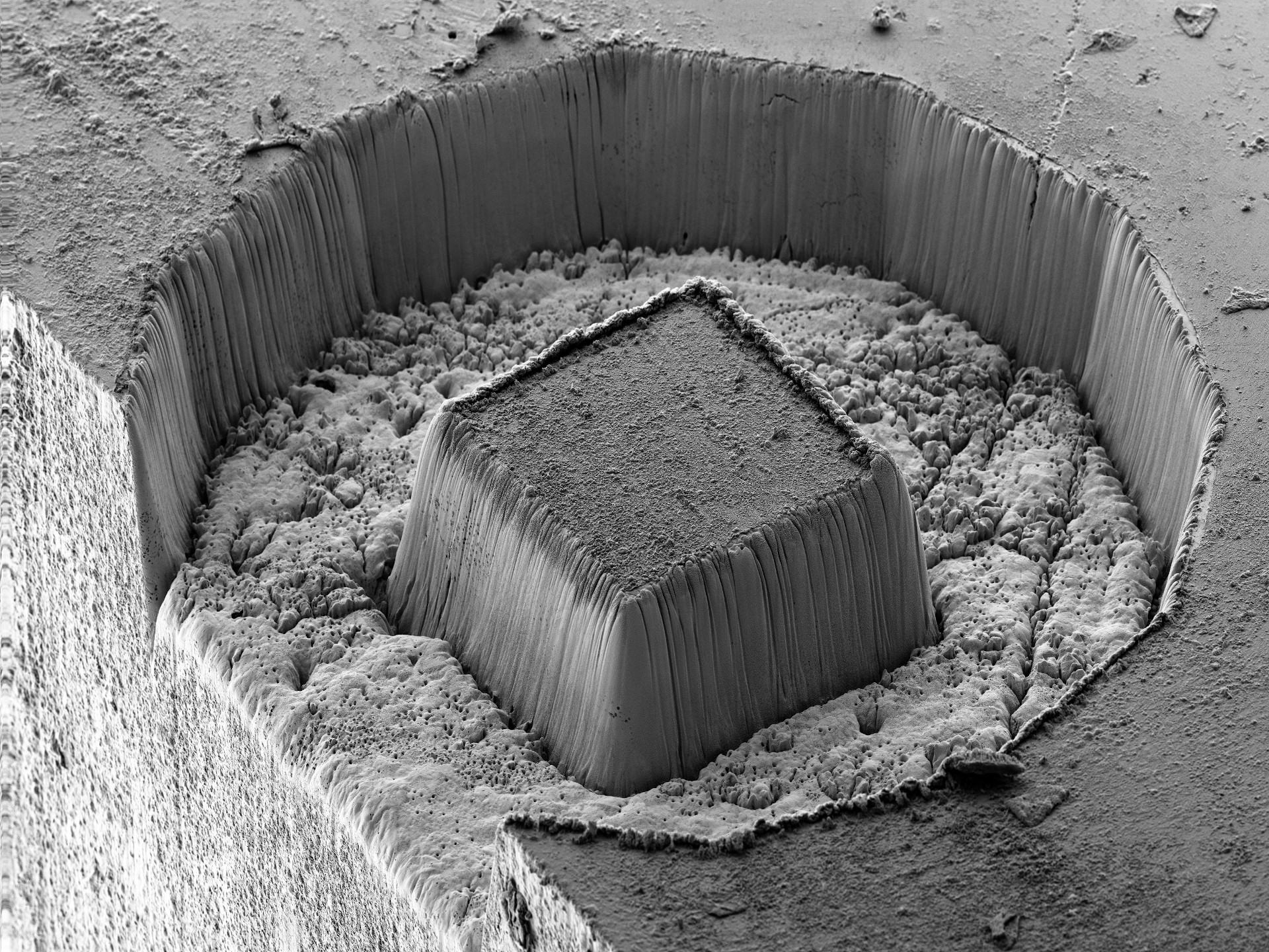 Laser prepared cube in a tungsten carbide cobalt hard metal sample (WCoC). The cube has side walls of 180 µm length and is 120 µm tall. Laser machining time 85 s. FOV 696 µm. ZEISS Crossbeam 350 laser, SESI detector, 5 kV. 