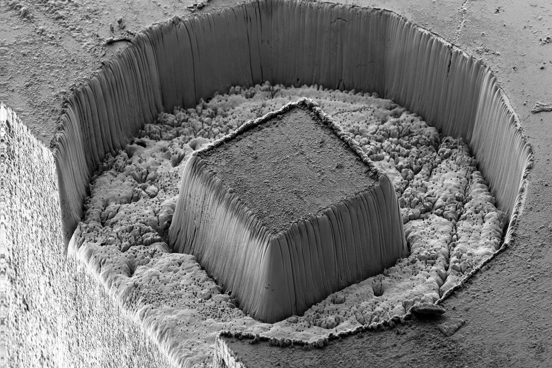 Laser prepared cube in a tungsten carbide cobalt hard metal sample (WCoC). The cube has side walls of 180 µm length and is 120 µm tall. Laser machining time 85 s. FOV 696 µm. ZEISS Crossbeam 350 laser, SESI detector, 5 kV. 