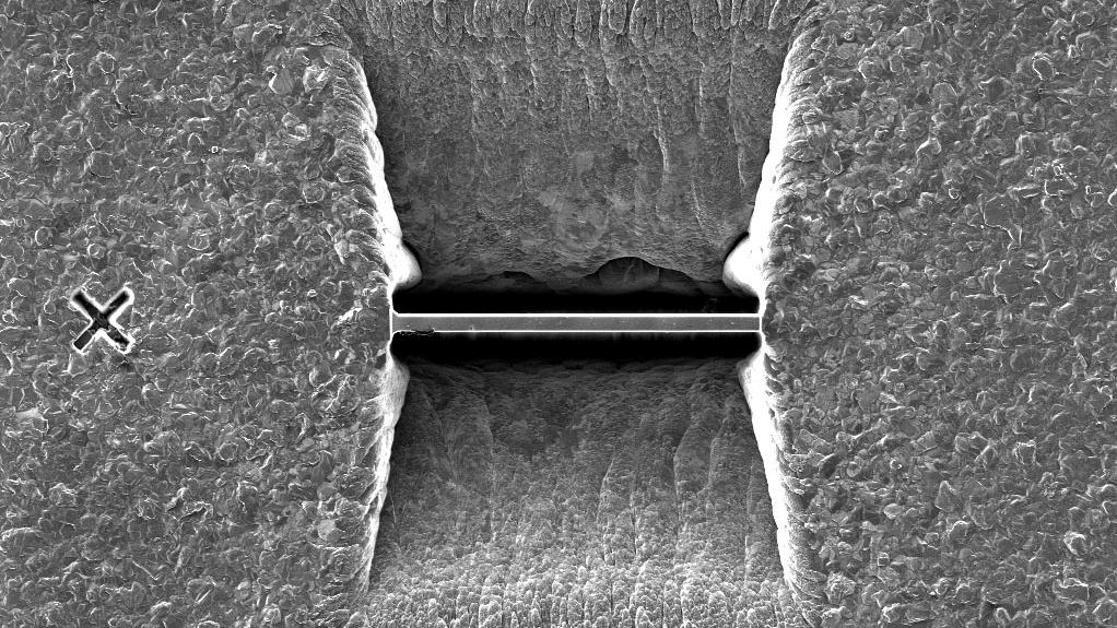 Fabricated with automatic sample preparation, prepared and imaged by FIB. Field of view 76.22 µm.