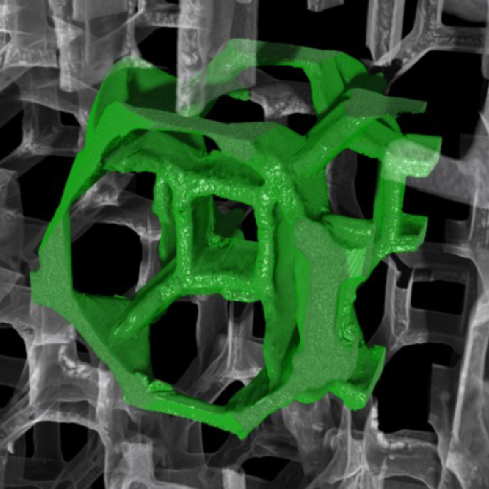 A single unit cell, highlighted in green, inside a Titanium-Carbide lattice.