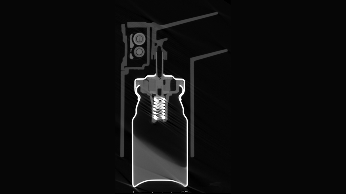 Asthma inhaler, showing details of a drug particulates blockage at the exit of the actuator. 2D slice in the center was obtained from a full 3D scan of the device using FPX.