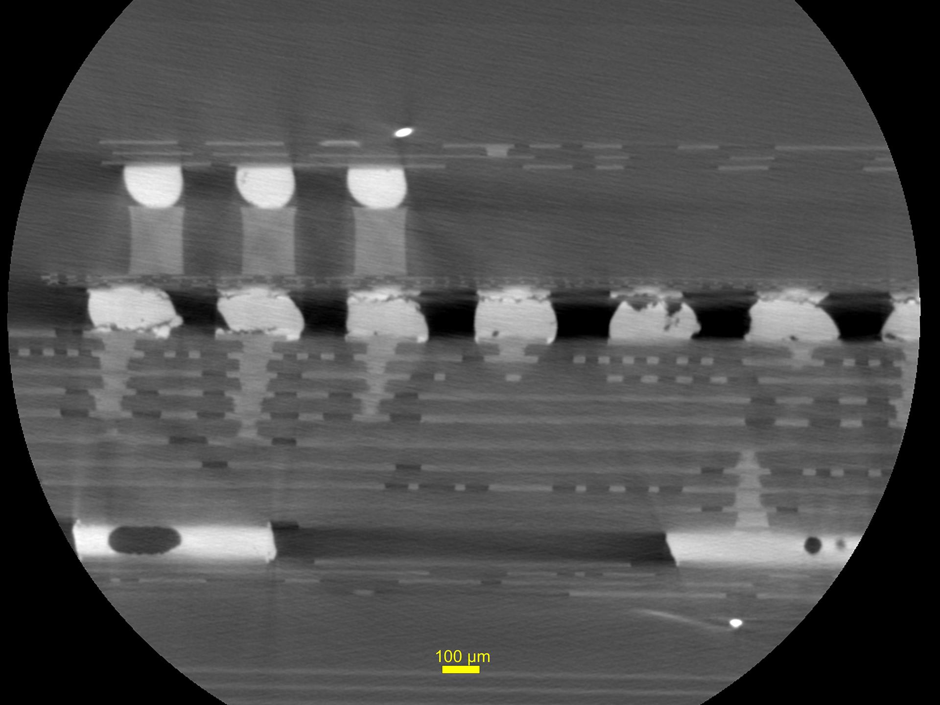 2D slice view of solder fatigue cracks in a thermal cycled smartphone control board at 2.5 μm voxel resolution.