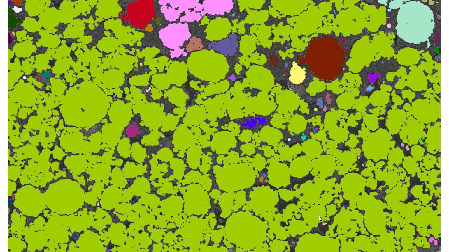 A computer-generated image of clusters of variously colored shapes, with a predominance of green circular shapes interspersed with fewer shapes in red, pink, purple, brown, and blue.