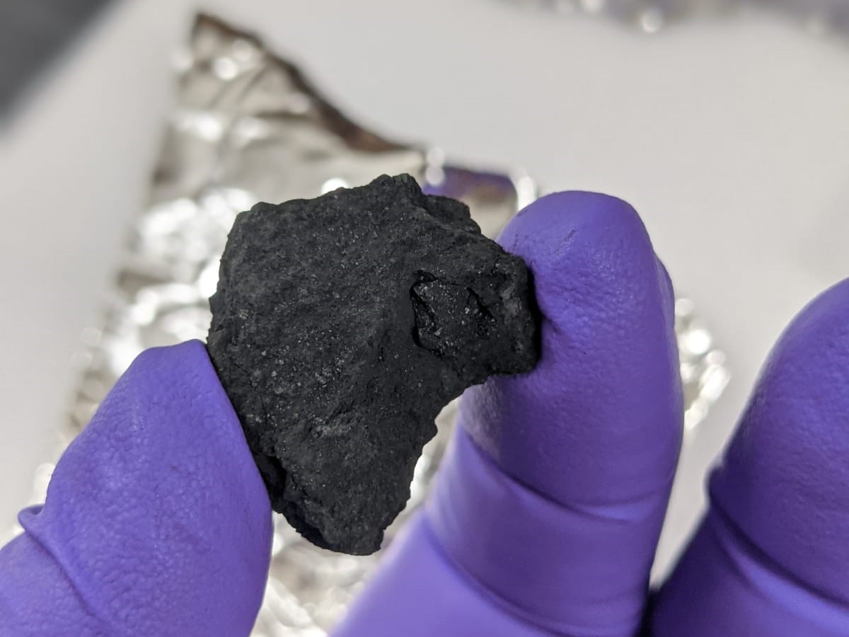 A fragment of the Winchcombe meteorite recovered from a residential driveway less than 12 hours after falling to Earth.
