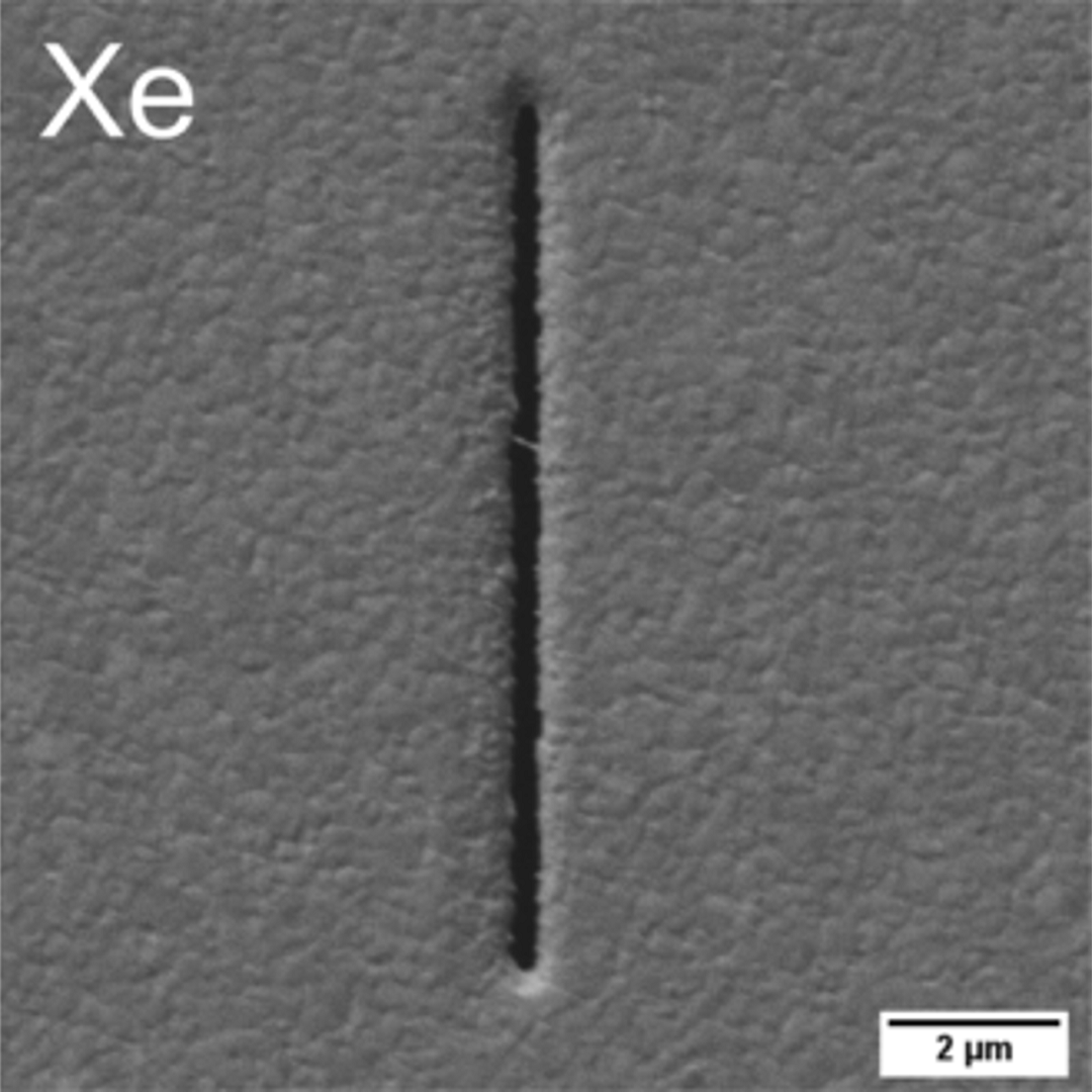 Geometry of notch milled in a gold film with FIB Xe ion species