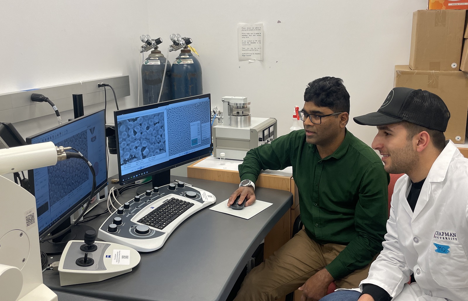 Dr. Molla Islam (left) working with a student at the ZEISS Sigma field emission scanning electron microscope.