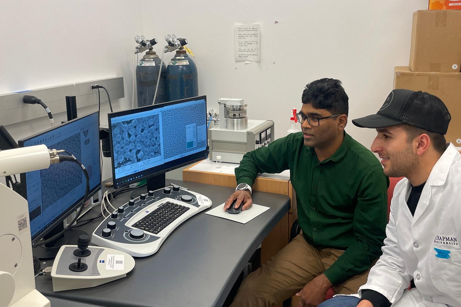 Dr. Molla Islam (left) working with a student at the ZEISS Sigma field emission scanning electron microscope.