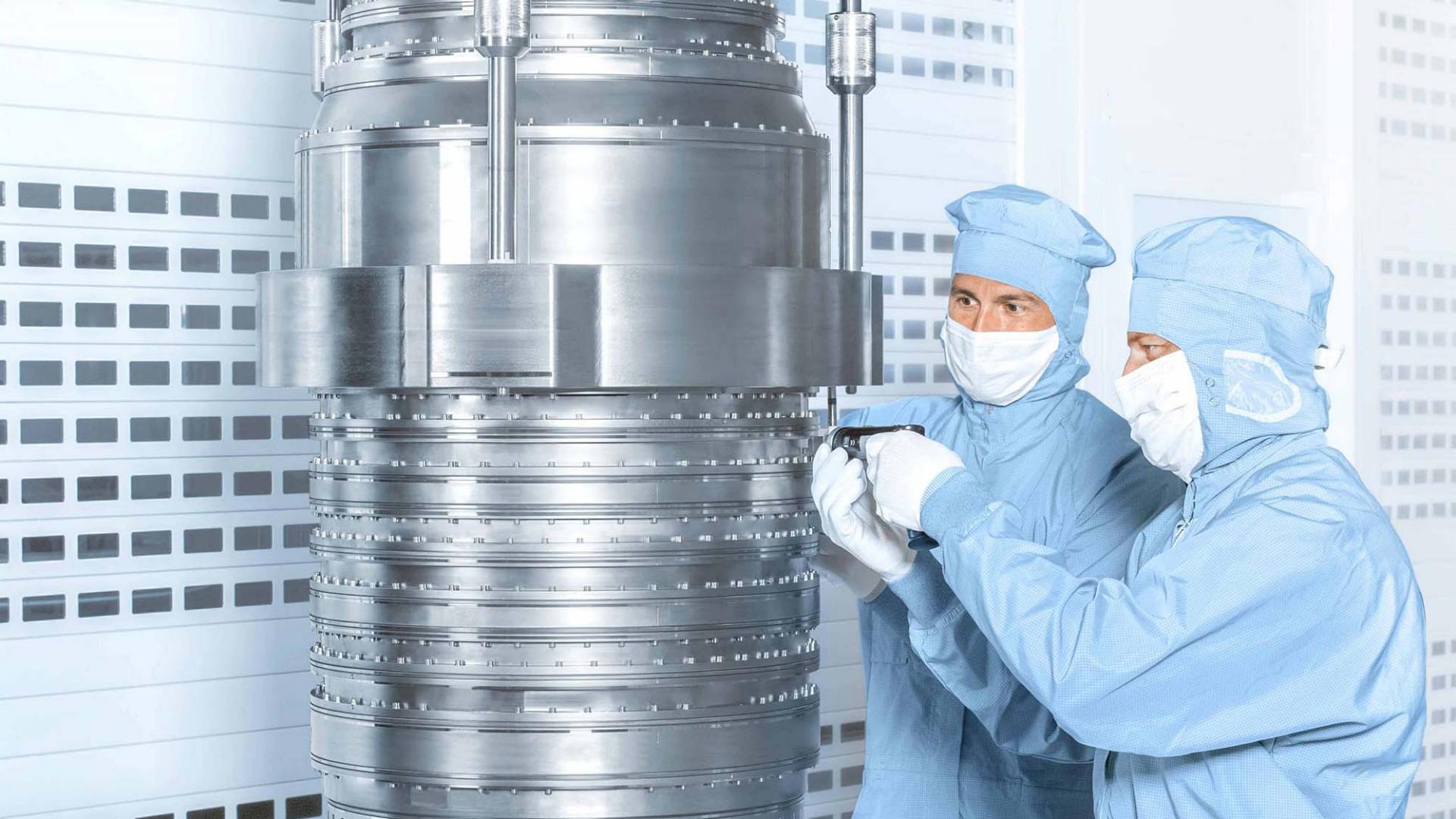 Employees in a clean room working on a DUV product