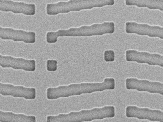 A section of a photomask with defects to repair