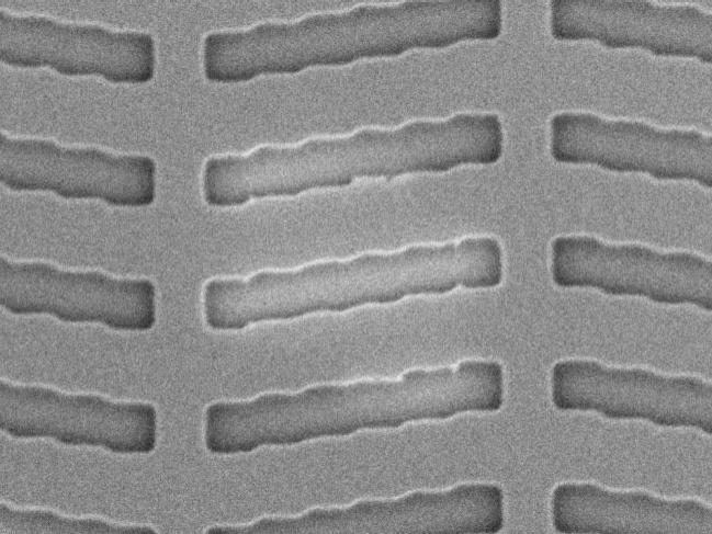 A section of a photomask whose defective structures have been repaired